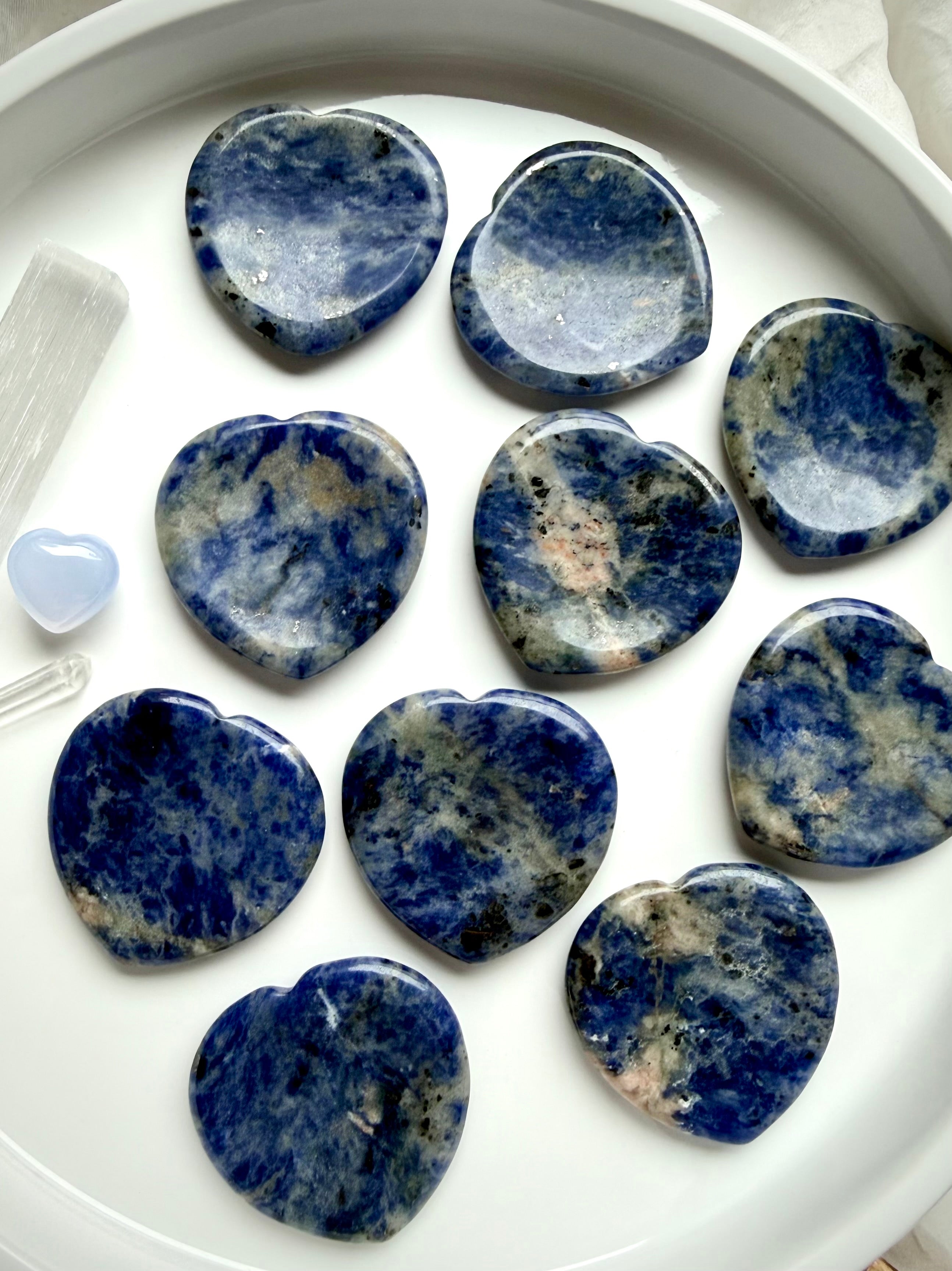 Sodalite heart worry stones with blue, gray, and white mottled patterns – throat chakra crystal thumb stones