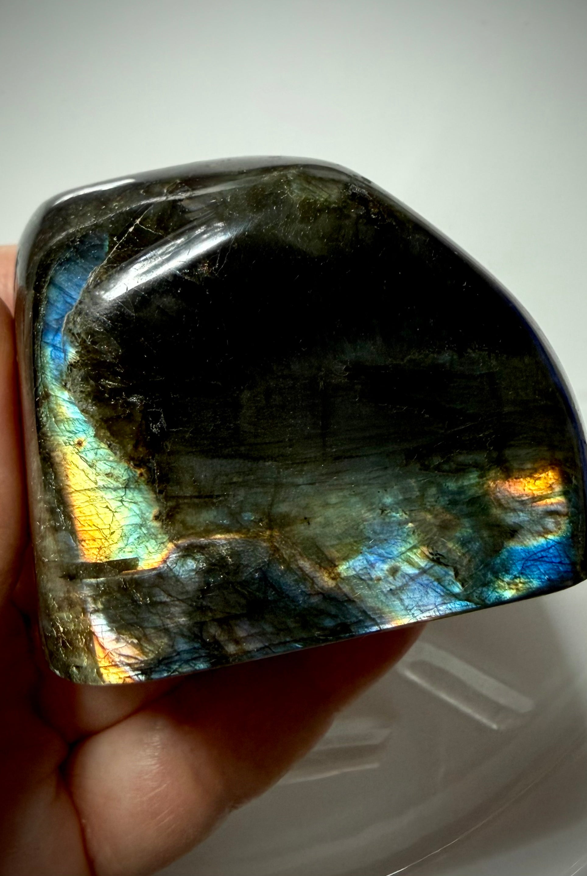 Polished Labradorite crystal with blue, gold and rainbow labradorescence, reverse side