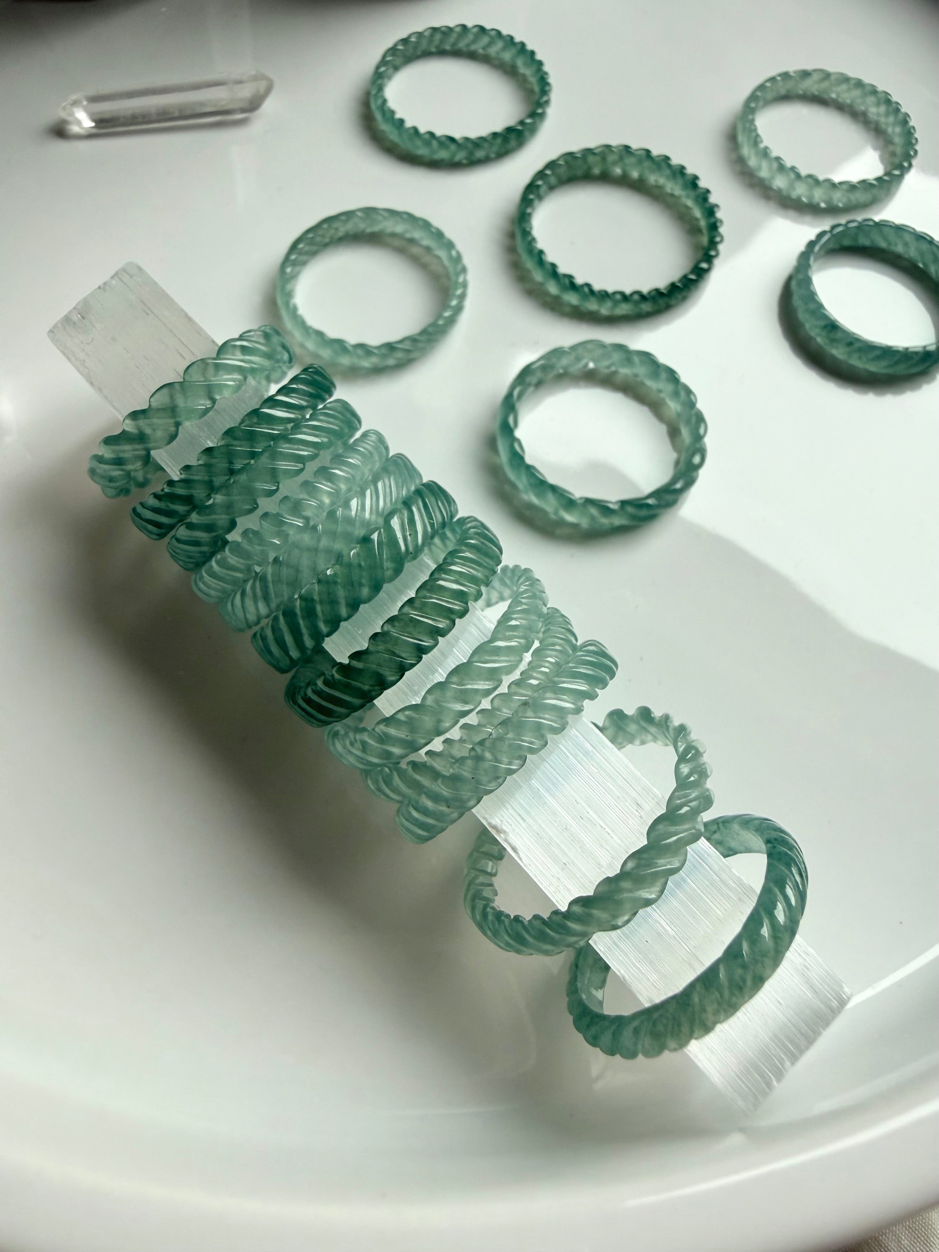 Premium Guatemalan jadeite woven ring showing braided ridges and high transparency blue-green tone