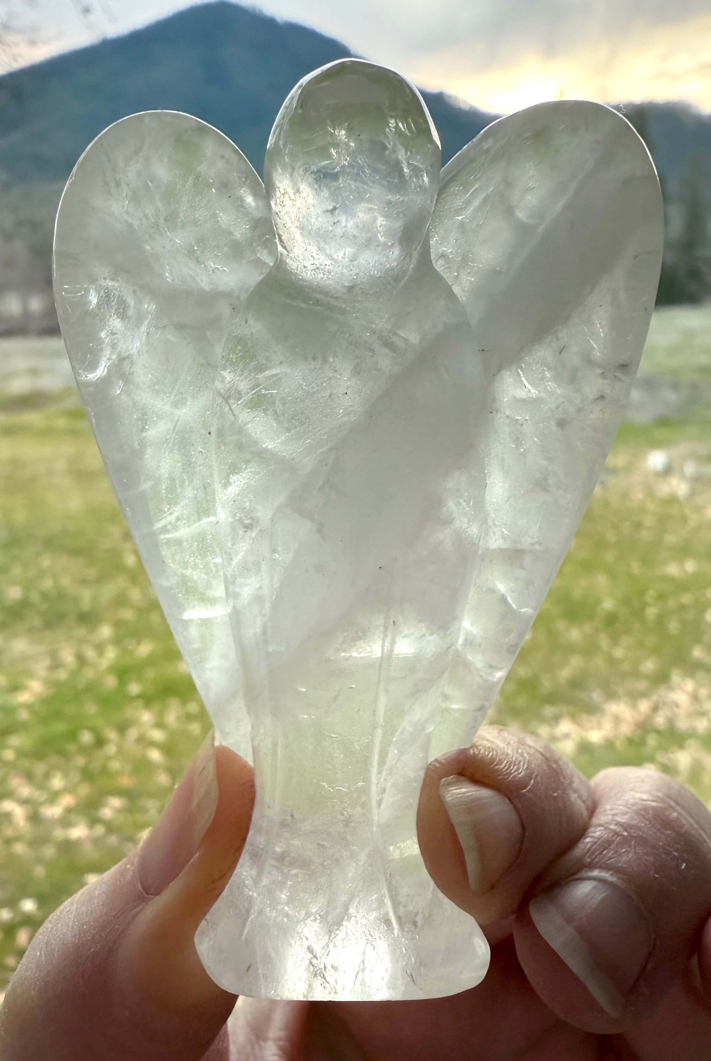The crystal angel figurine has a beautiful natural zigzag pattern in the stone