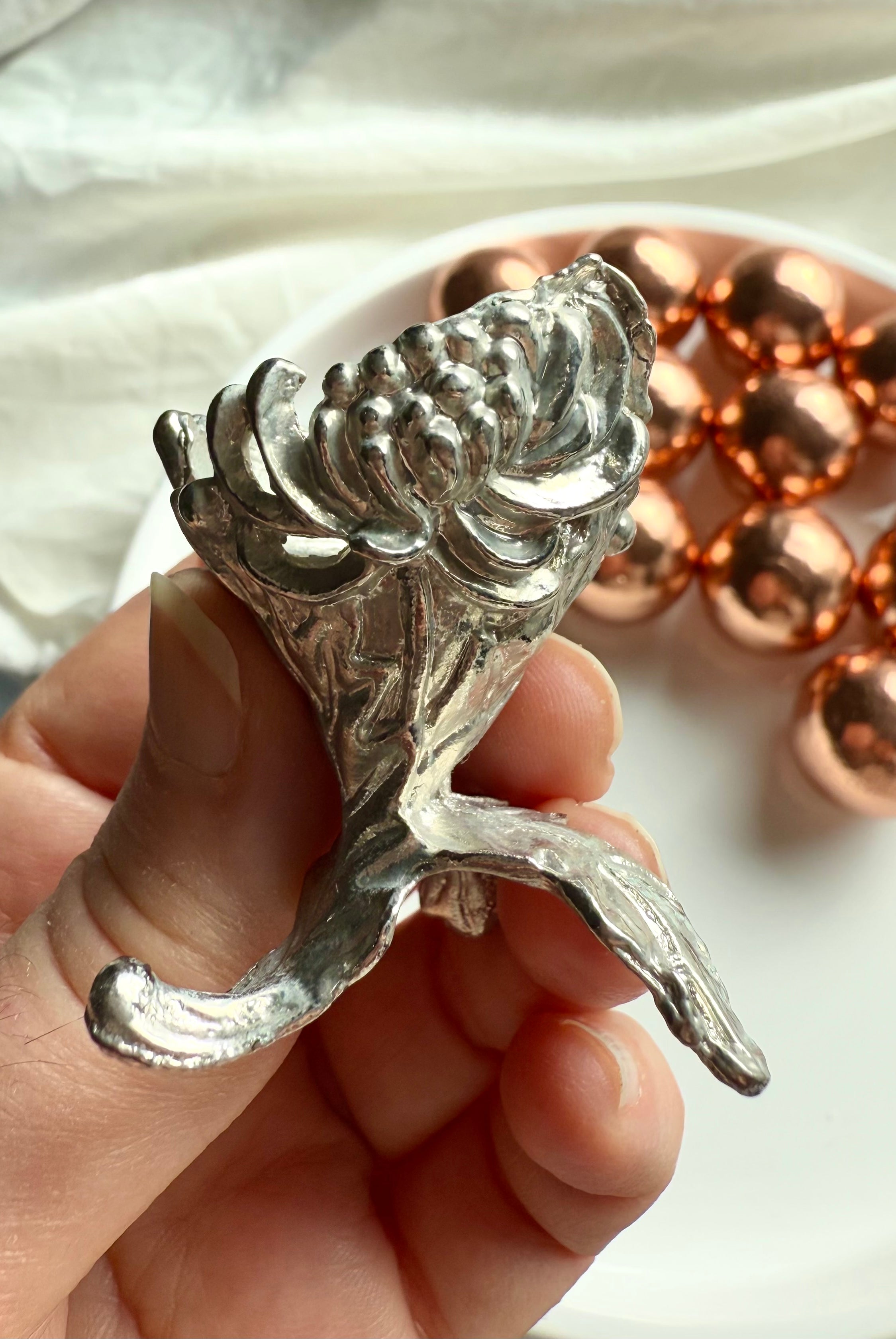 Our mini sphere stand has a beautiful chrysanthemum design in solid cast metal for small spheres