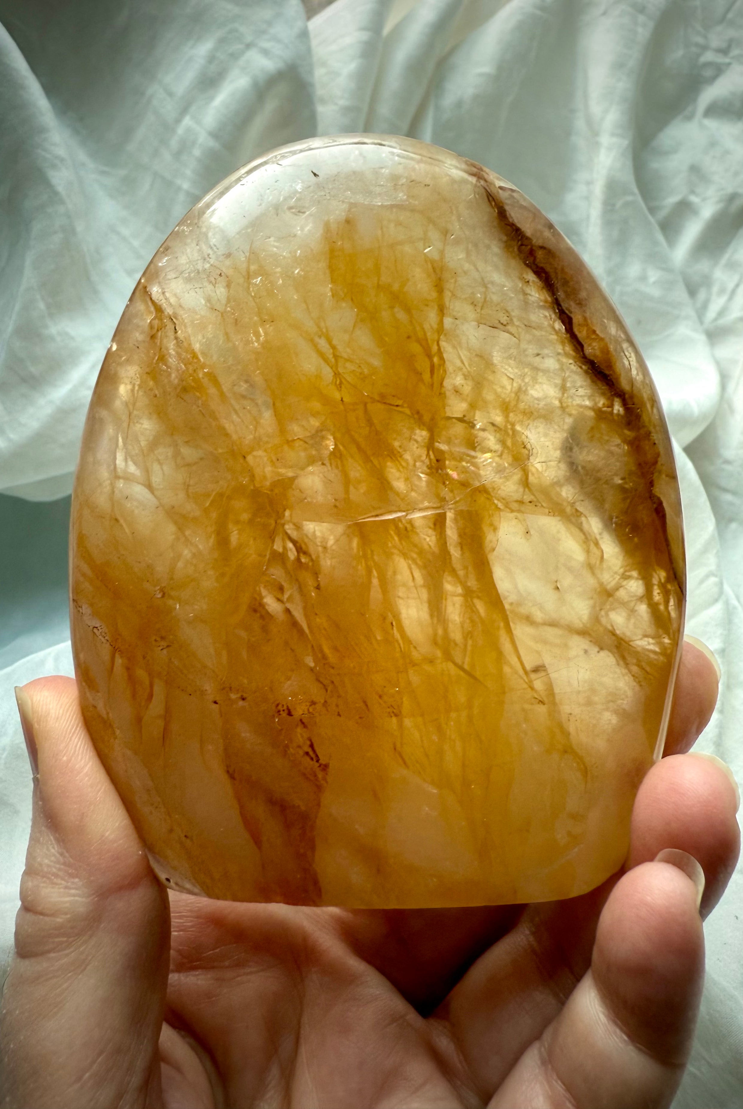 Golden Healer Quartz crystal freeform with glowing internal inclusions and rich honey gold coloration