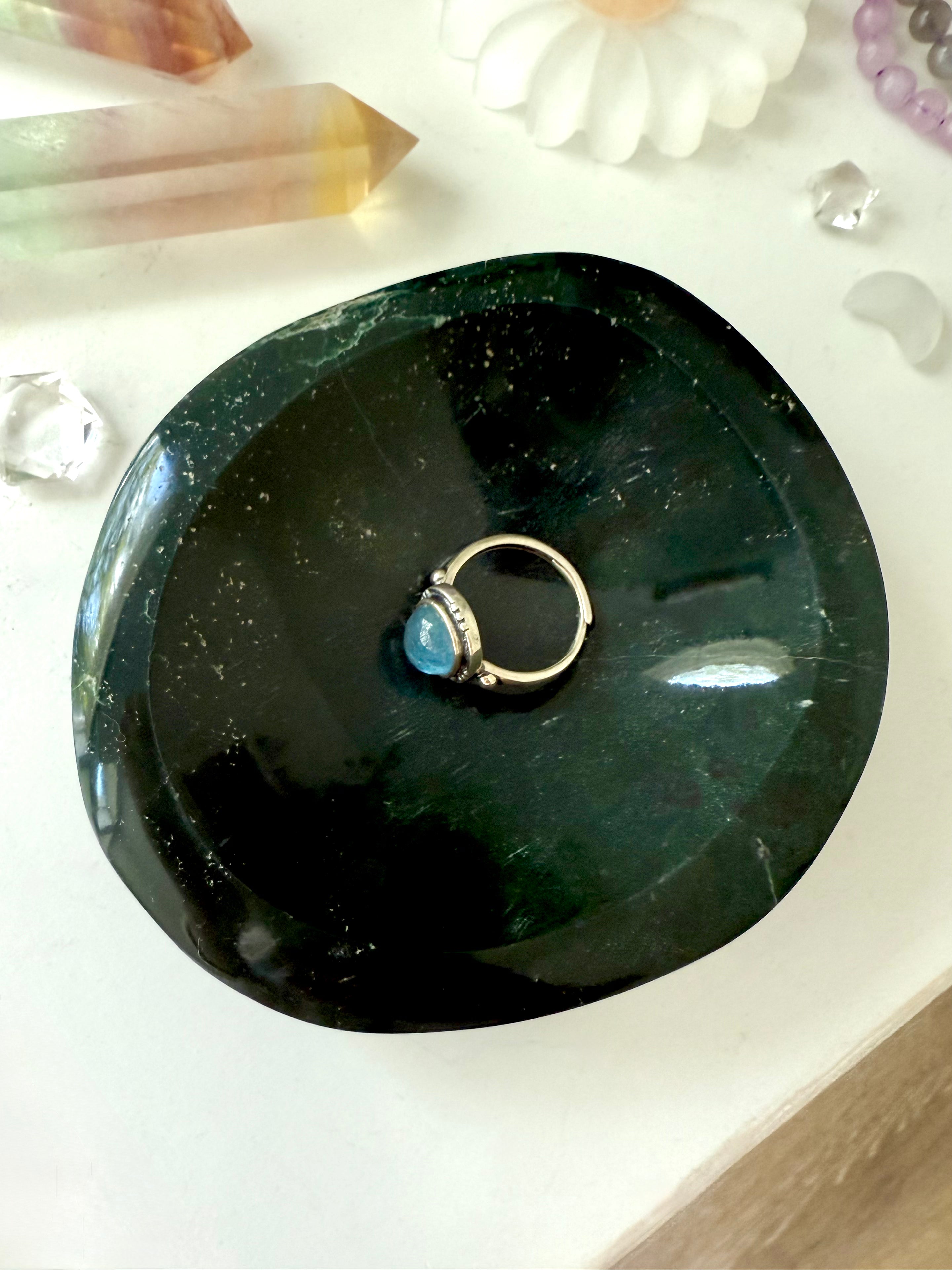 A one of a kind hand carved ocean jasper crystal bowl to organize + display your jewelry in style