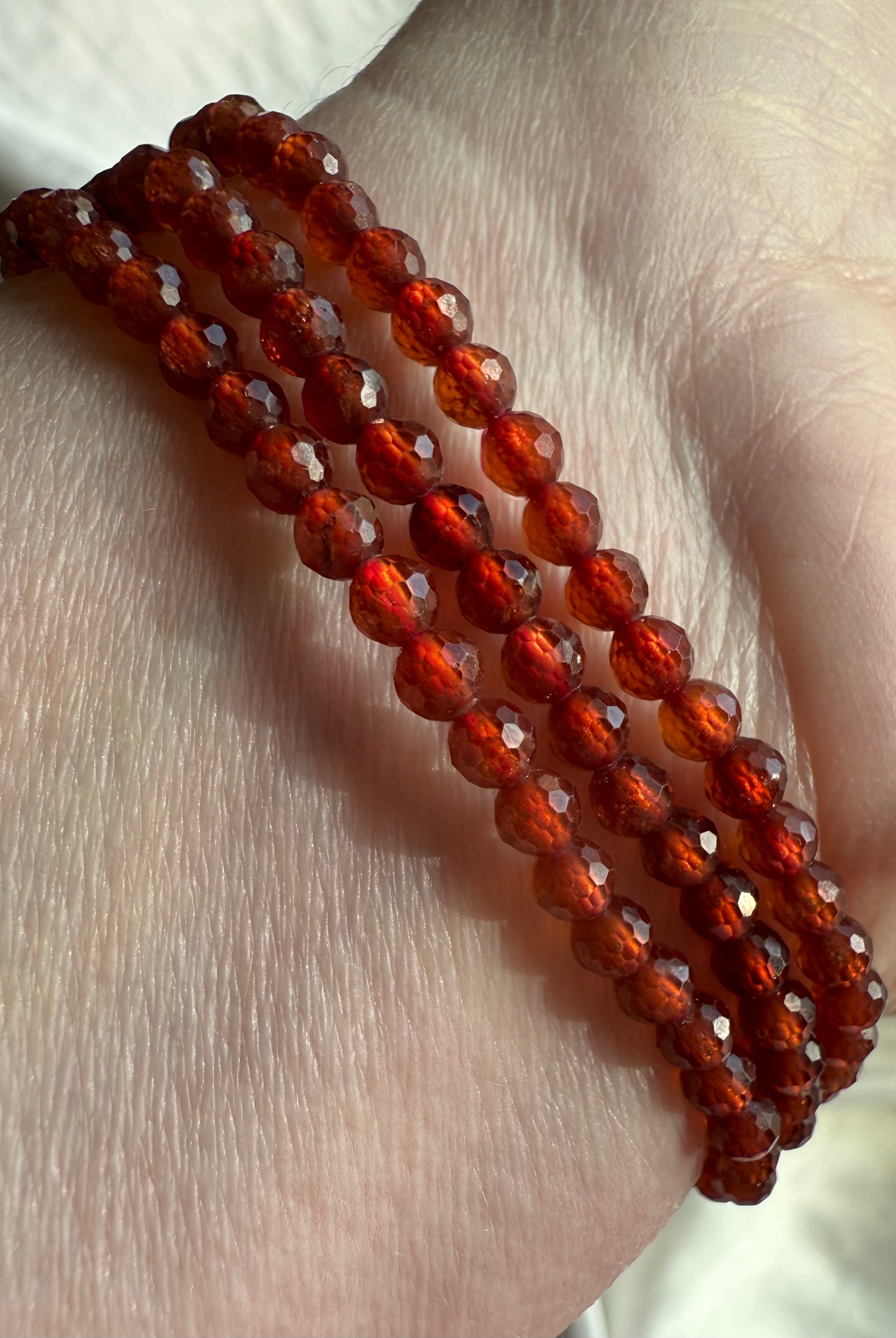 Our sparkly faceted Spessartite Garnets can be worn as a Wrap Bracelet or Necklace