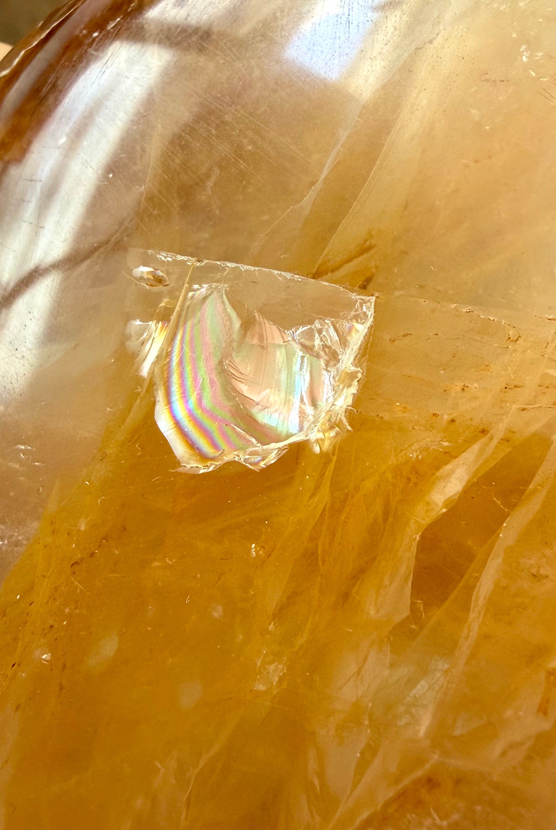 Closeup of a rainbow in a Golden Healer Quartz freeform crystal for meditation, energy healing, and spiritual growth
