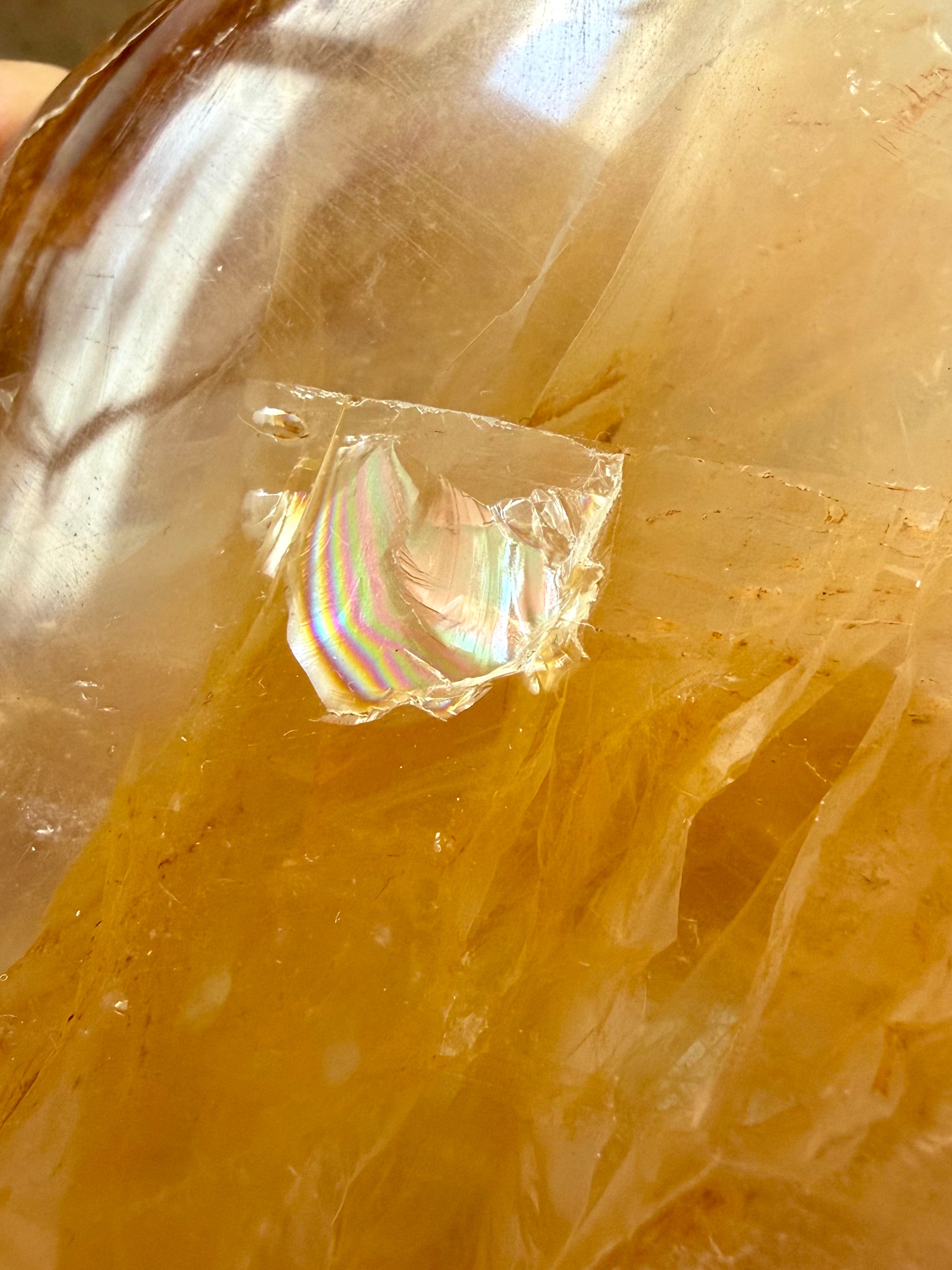 Closeup of a rainbow in a Golden Healer Quartz freeform crystal for meditation, energy healing, and spiritual growth