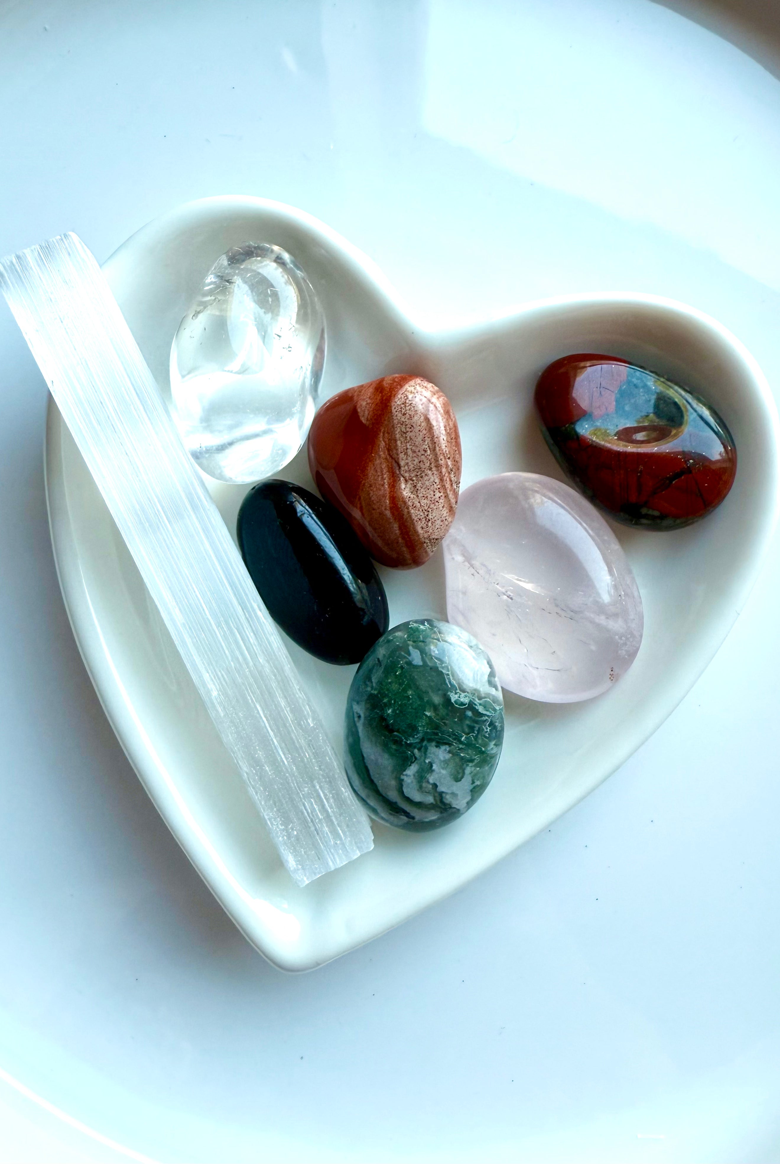 Healing stones in optional white heart bowl, including Selenite, Moss Agate, and Clear Quartz