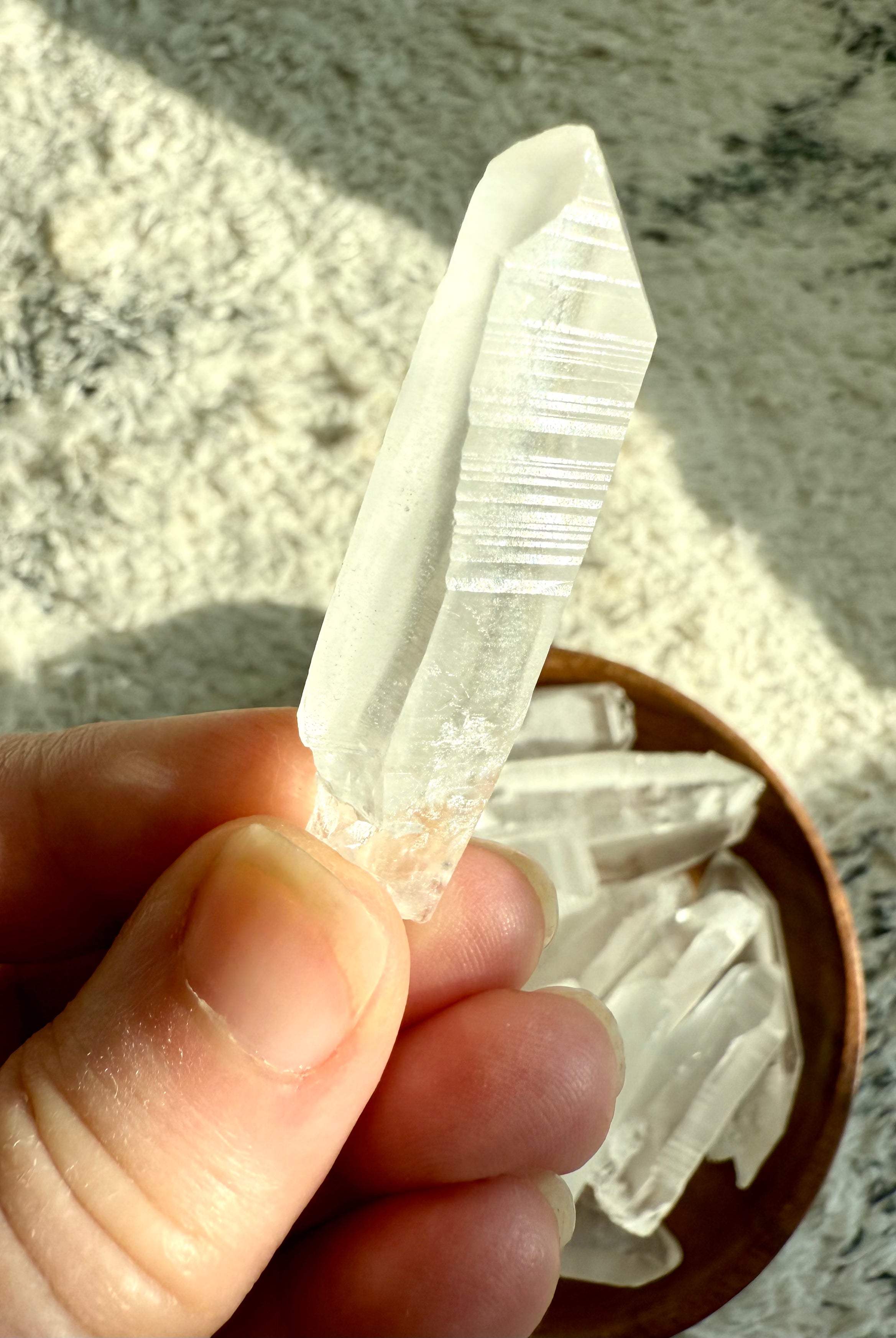 Close-up of Lemurian point with etched striations — spiritual tool for accessing higher realms and soul-level remembrance.