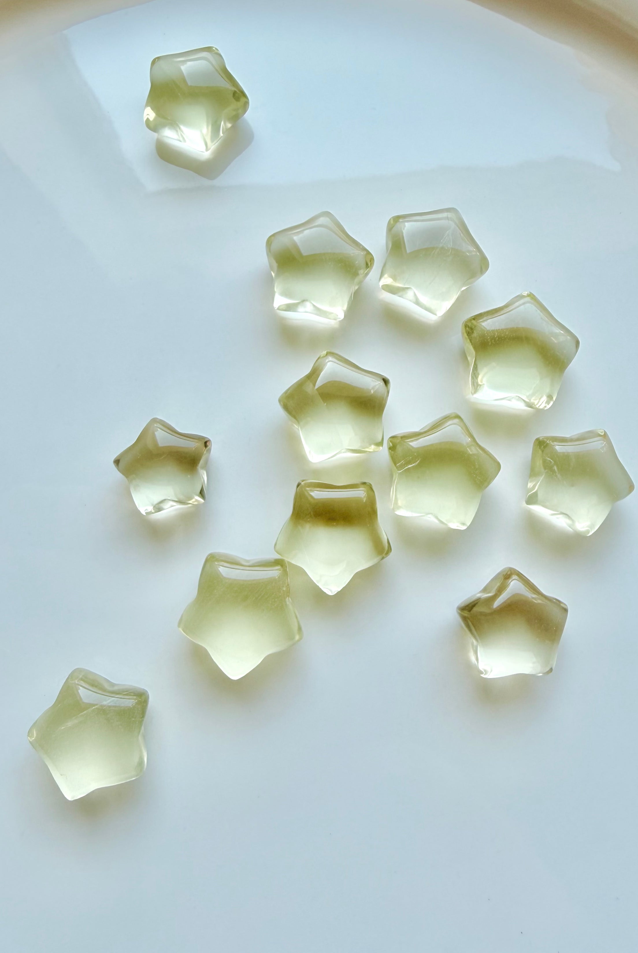 Mini Lemon Citrine stars showing translucent golden-yellow color and subtle natural crystalline patterns