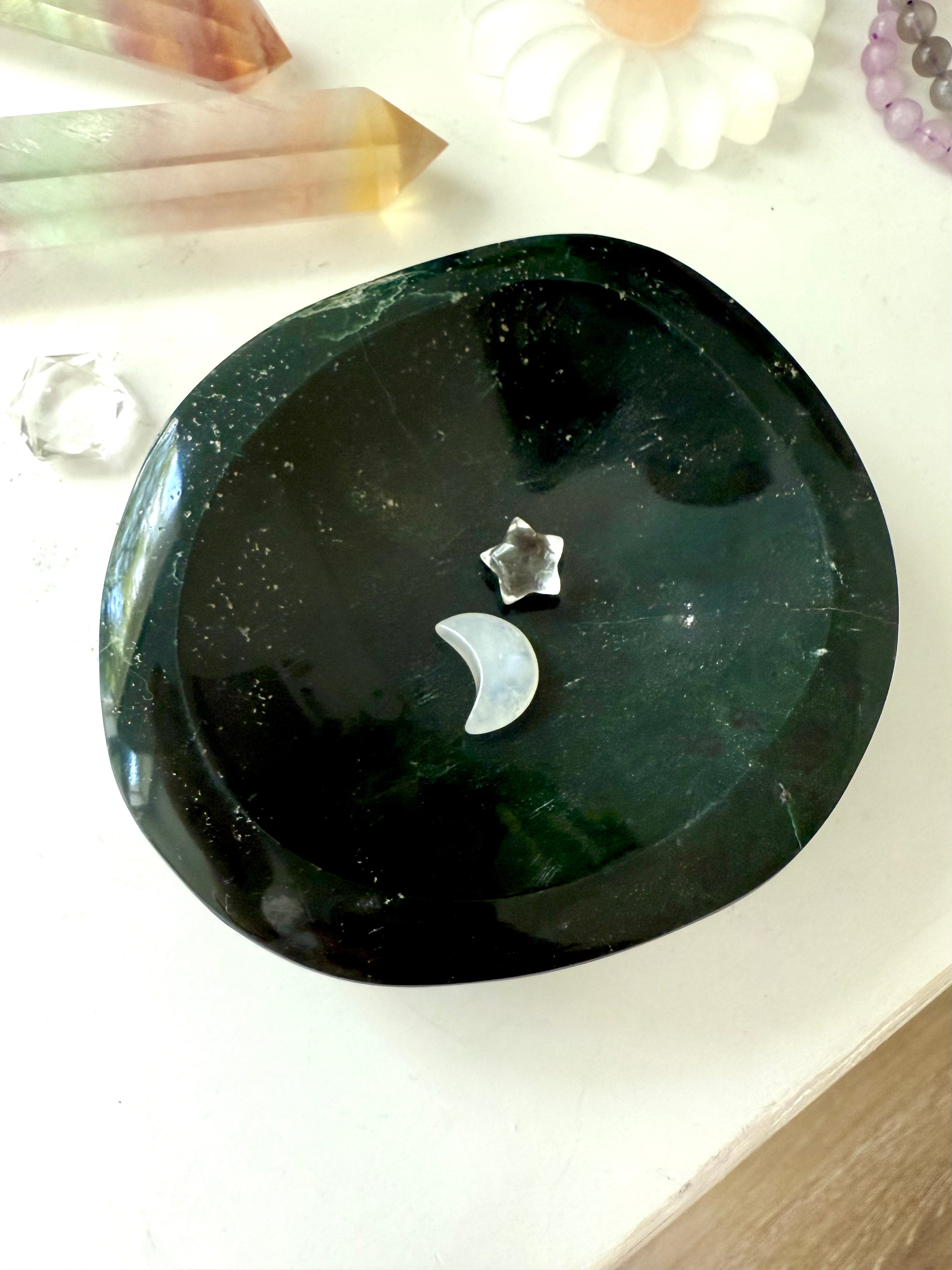 A one of a kind hand carved ocean jasper crystal bowl to organize + display your crystals in style
