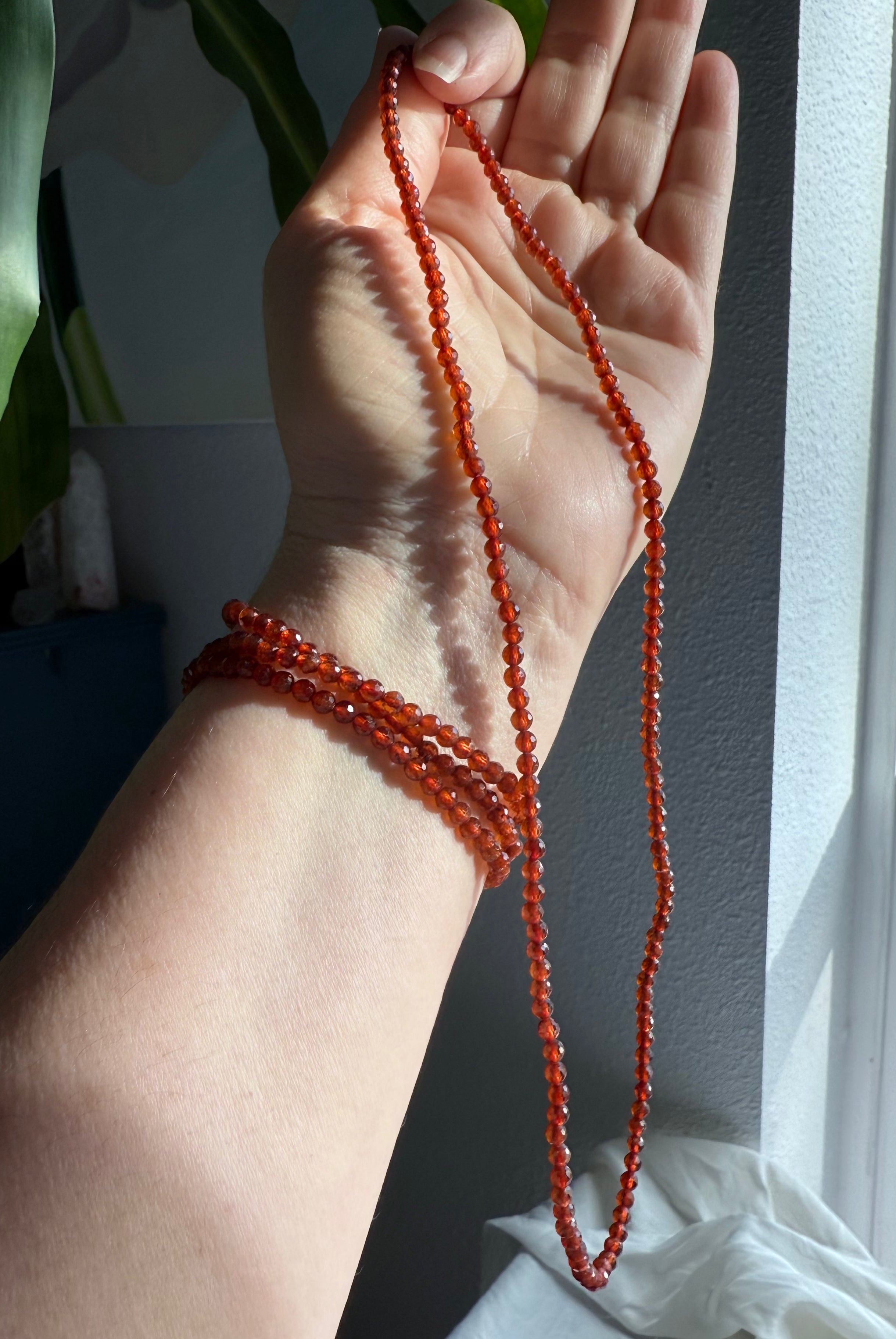 Our sparkly faceted Spessartite Garnets can be worn as a Wrap Bracelet or Necklace