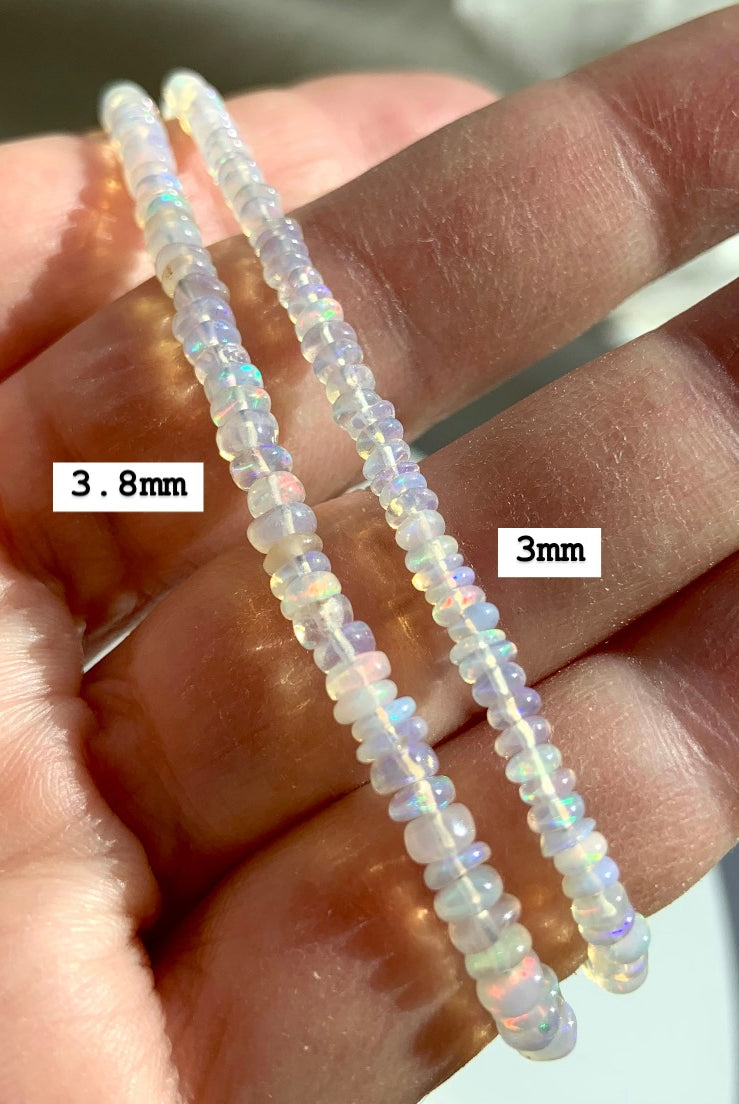 Comparison of the two bead sizes available in our Ethiopian Opal Bracelets