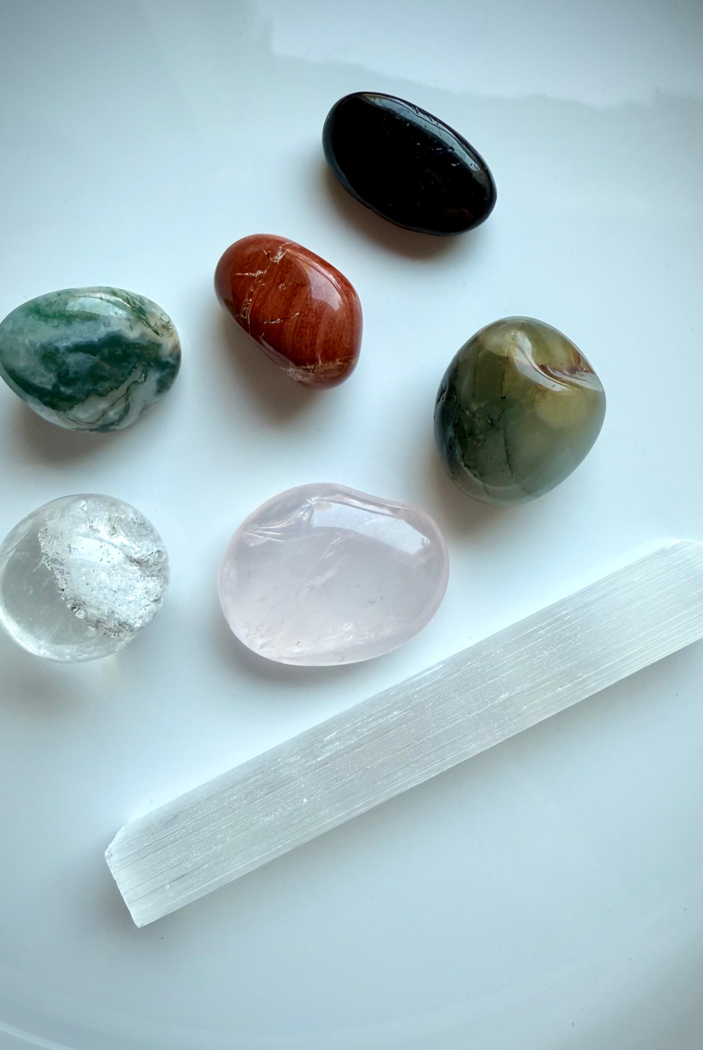 Get Well crystals with natural variation in size and color, shown on white background