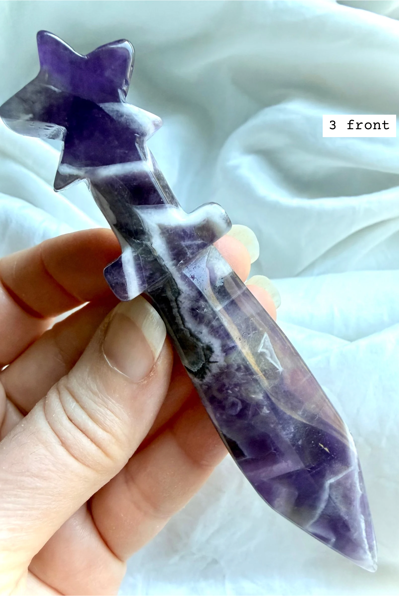 Dream Amethyst crystal star knife carving with purple chevron banding and celestial star handle