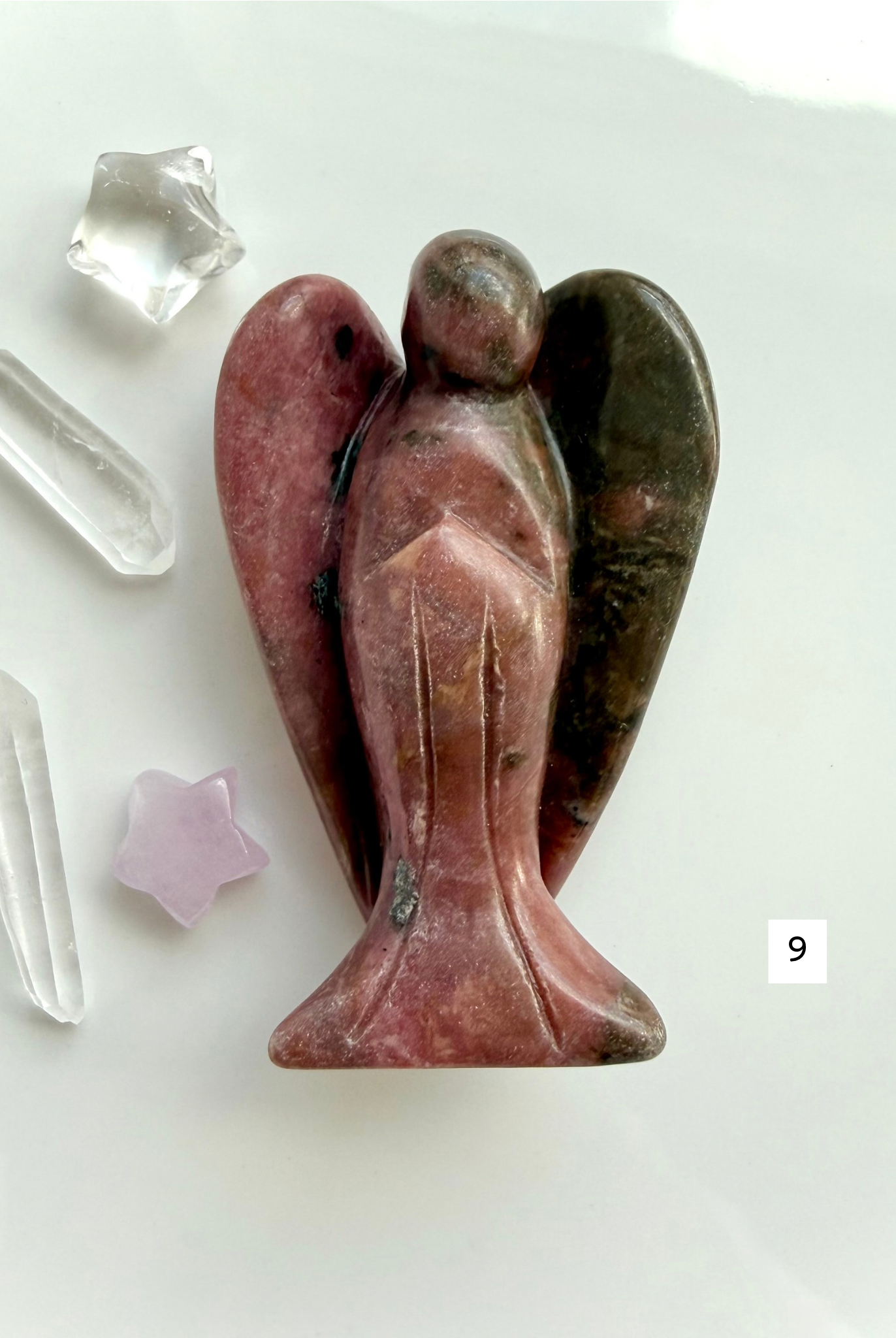 Rhodonite angel carving with rich rose pink coloring and polished wings for love and emotional balance