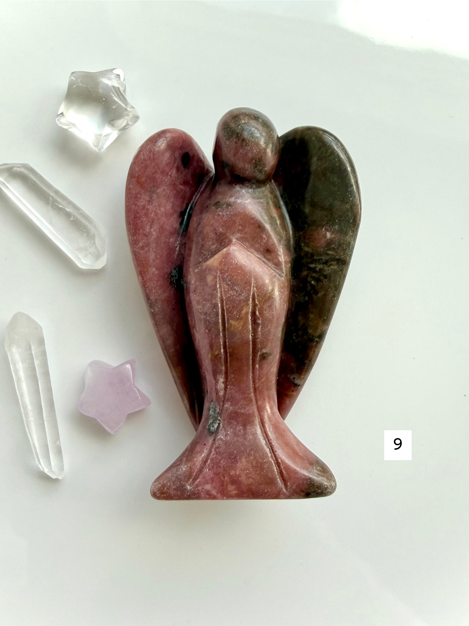 Rhodonite angel carving with rich rose pink coloring and polished wings for love and emotional balance
