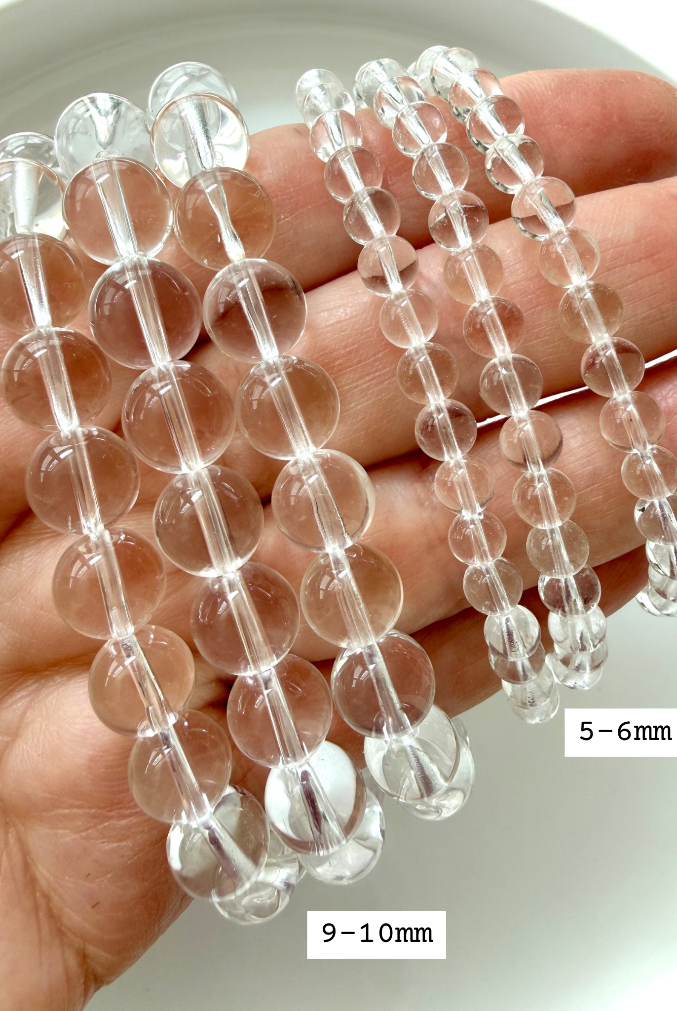 High quality Clear Quartz bracelets marked with bead sizes showing transparent crystal beads