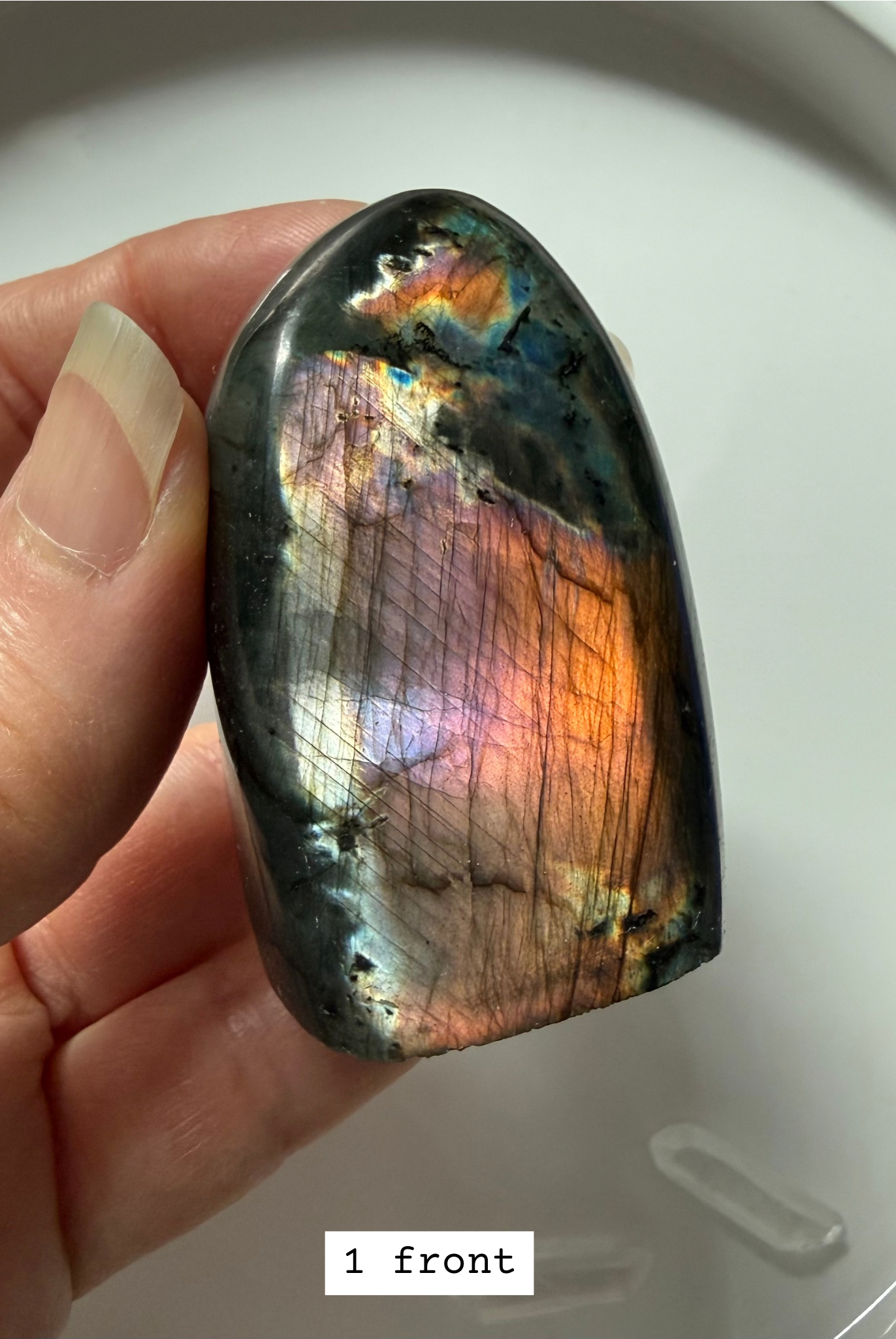 Polished labradorite freeform with pink, purple, and rainbow flash.