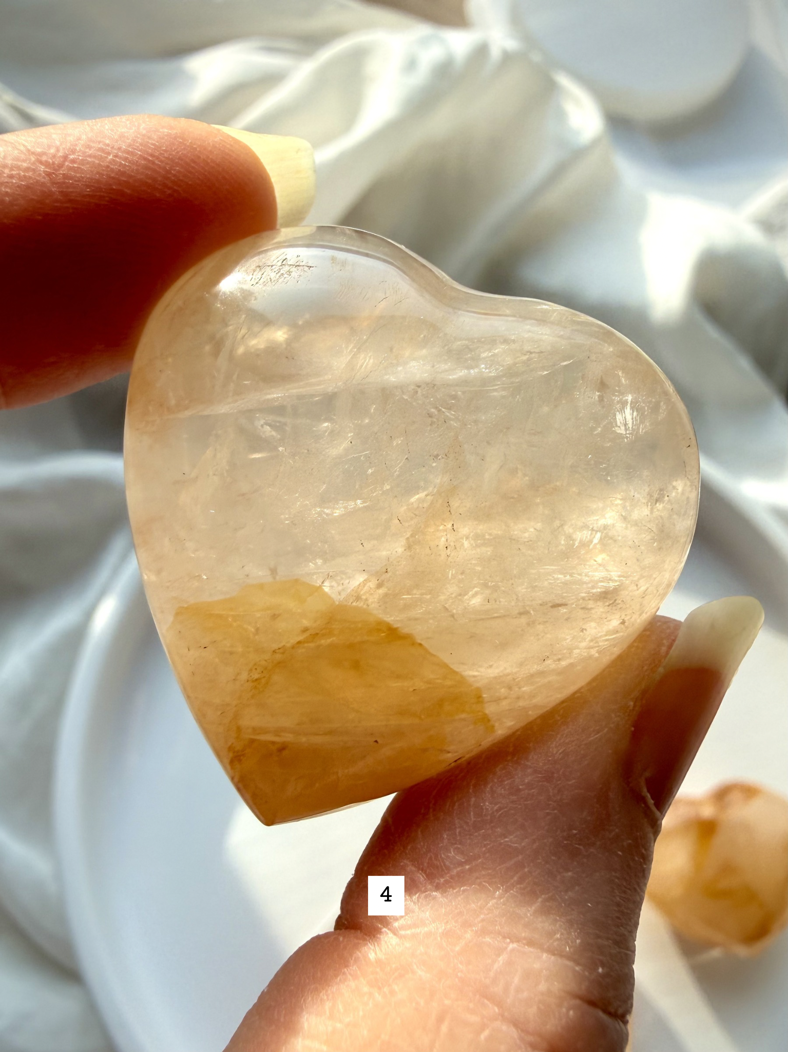 golden healer quartz heart number 4 with light golden hues and subtle natural inclusions