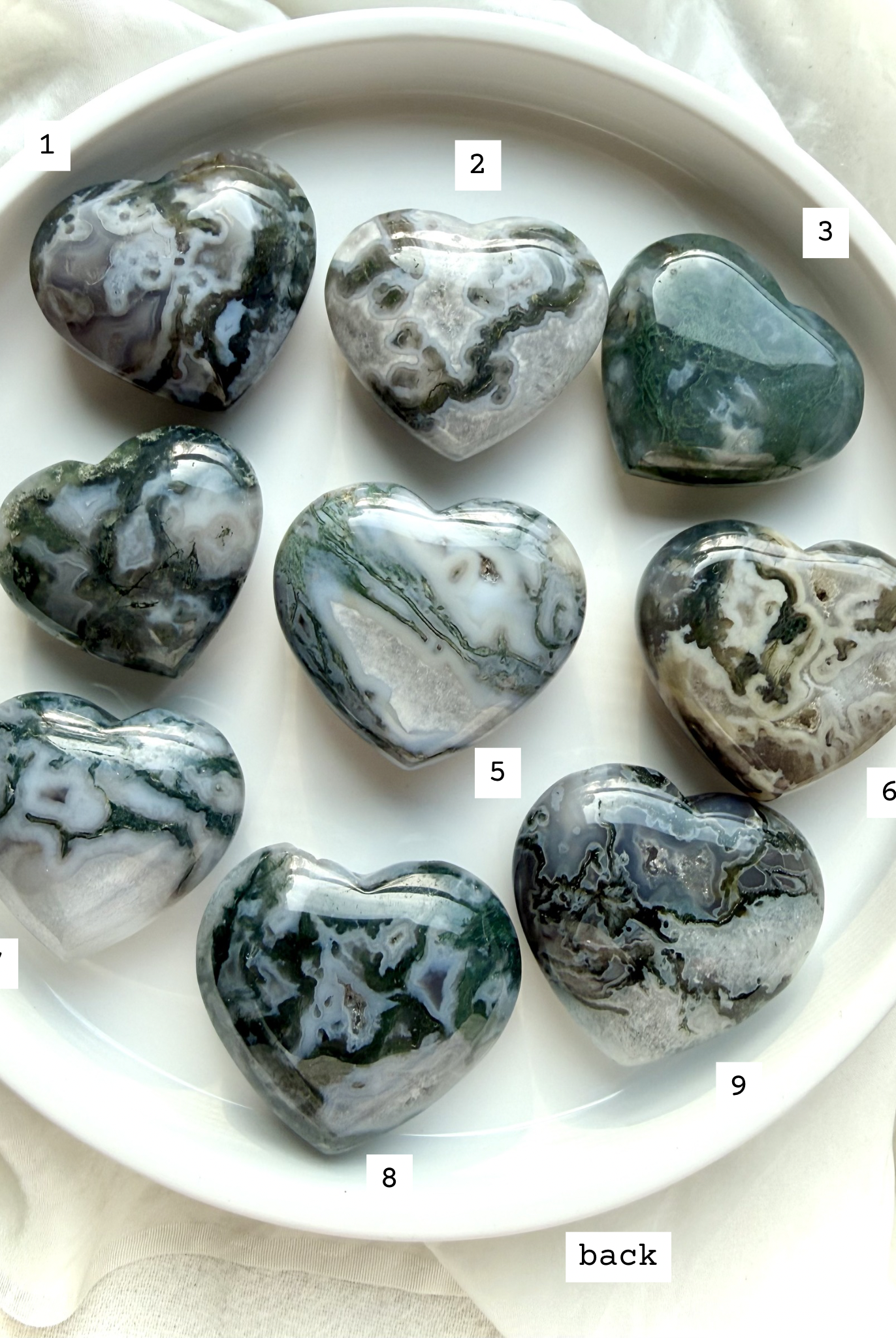 moss agate heart carvings options 1 through 9 front view choose your favorite crystal hearts with natural green inclusions and patterns