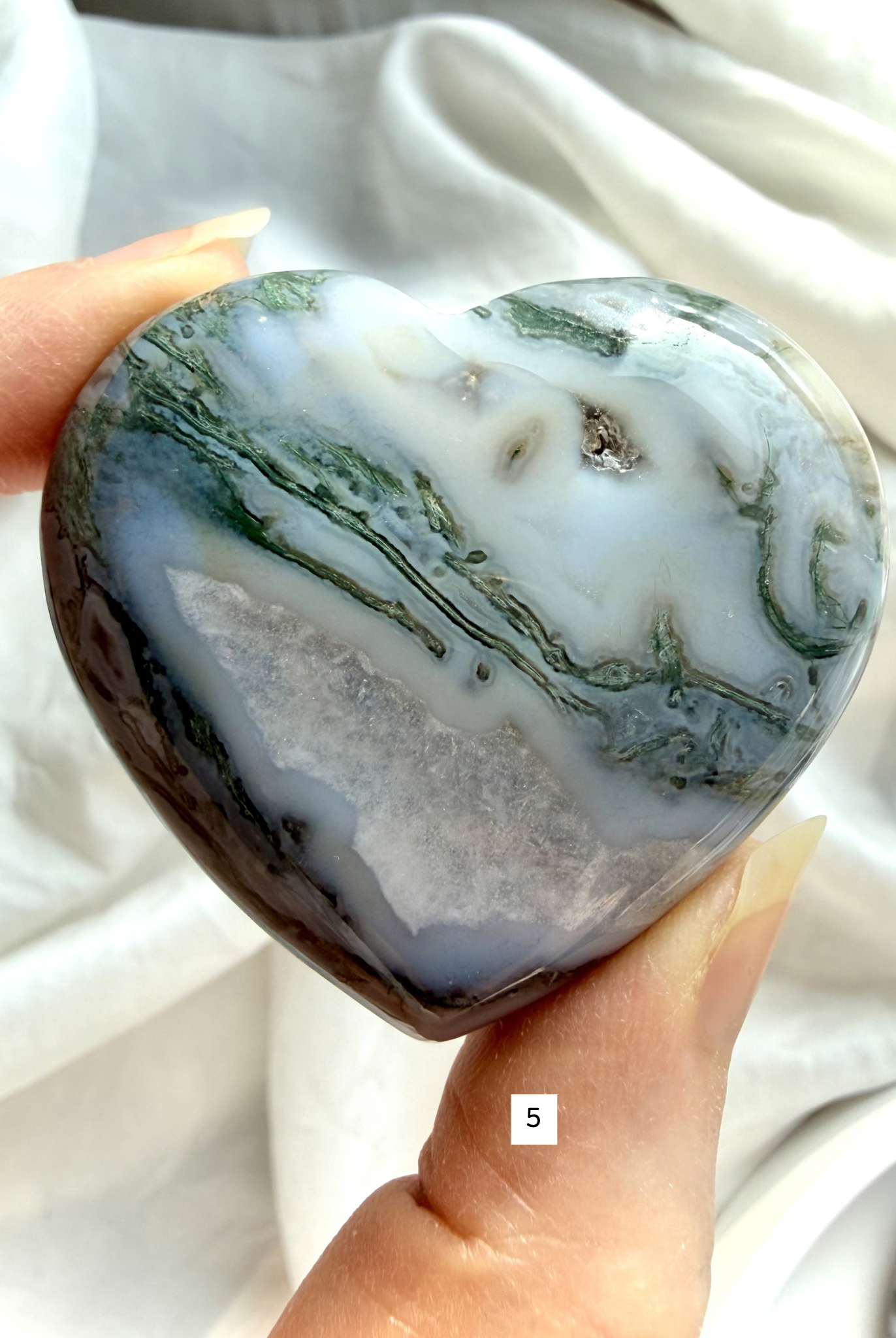 moss agate heart carving option 5 in hand with druzy pocket and layered mineral inclusions