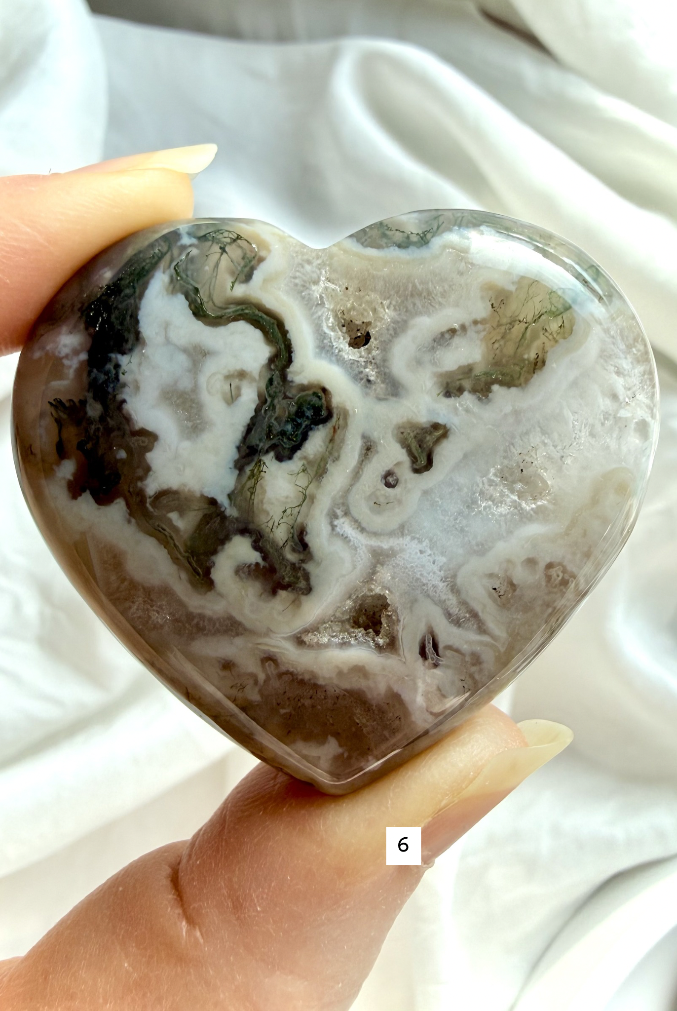 moss agate heart carving option 6 in hand with mossy green formations and polished crystal surface