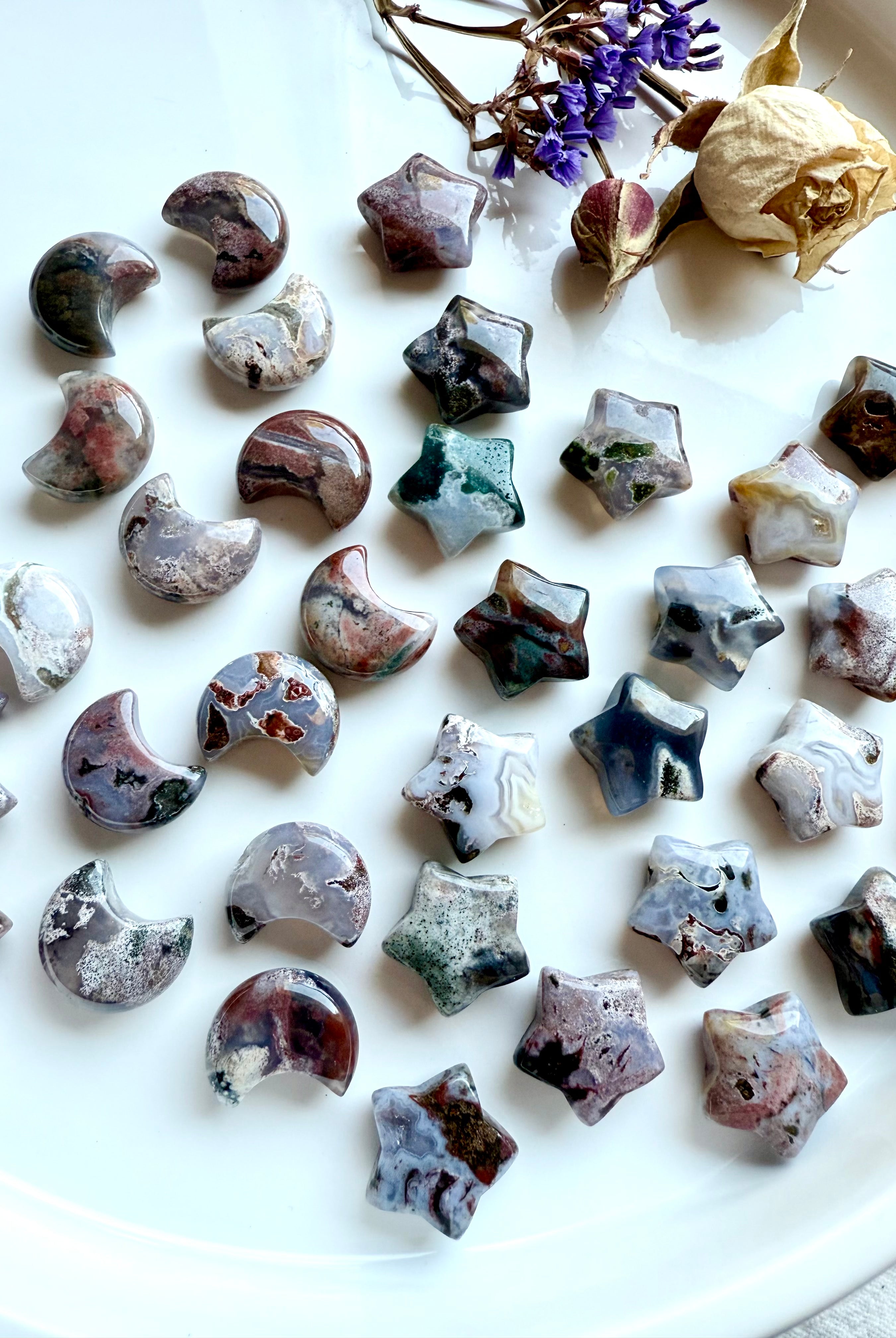 Ocean Jasper mini moons and stars with multi-colored patterns in green, lavender, brown, and cream — celestial healing crystals