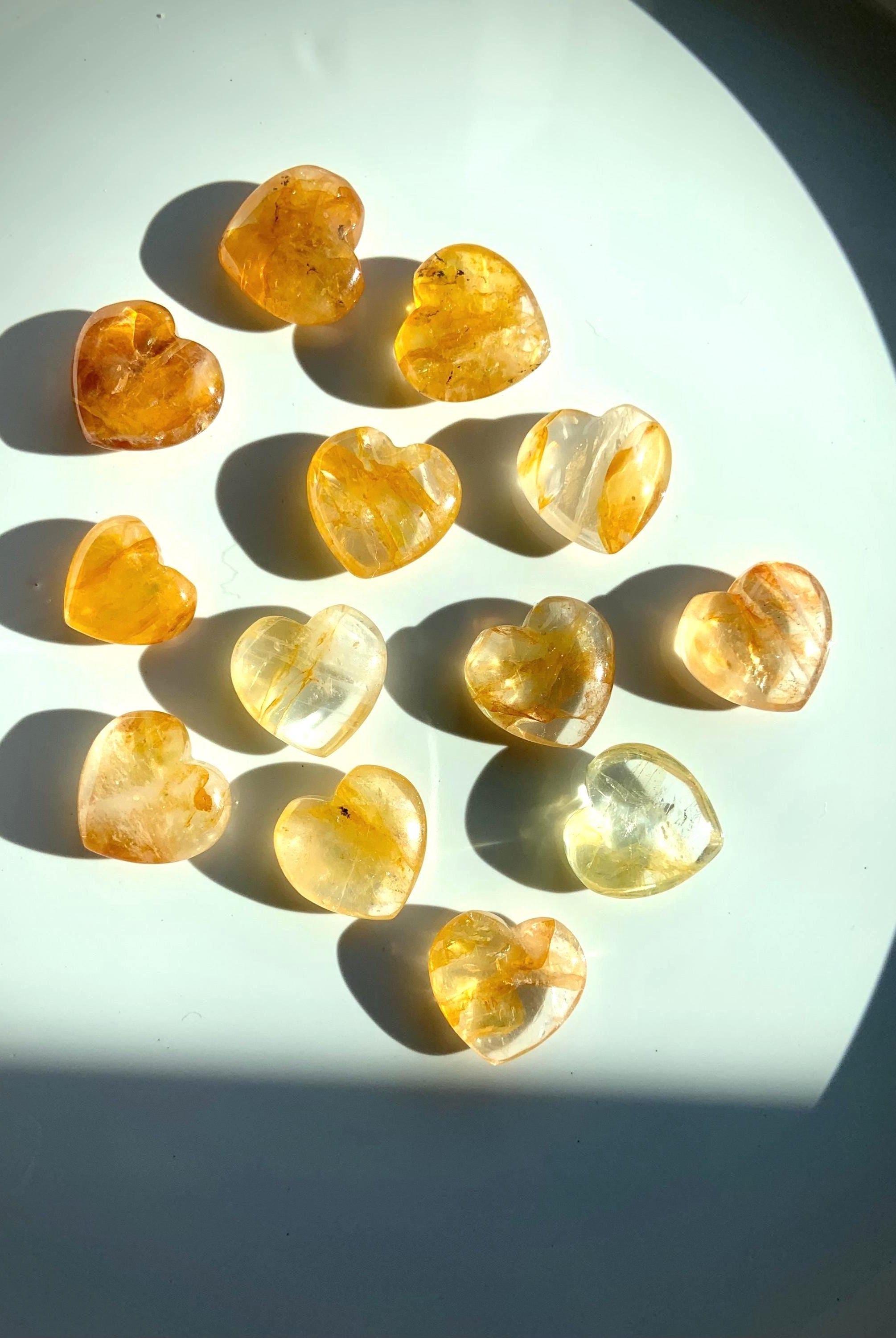 Tiny Golden Healer Crystal Hearts shown in dramatic natural light