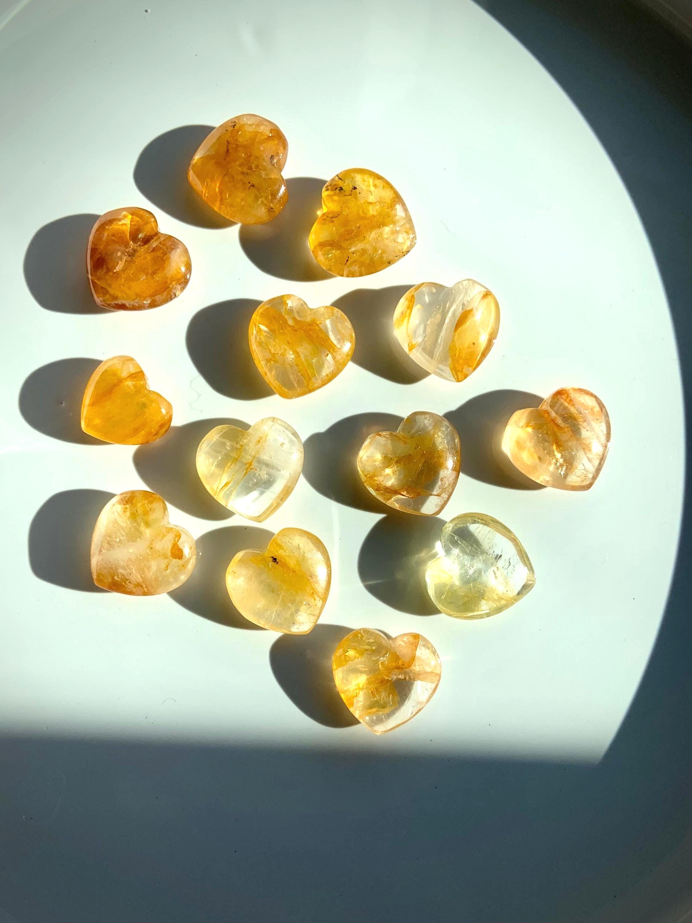 Tiny Golden Healer Crystal Hearts shown in dramatic natural light