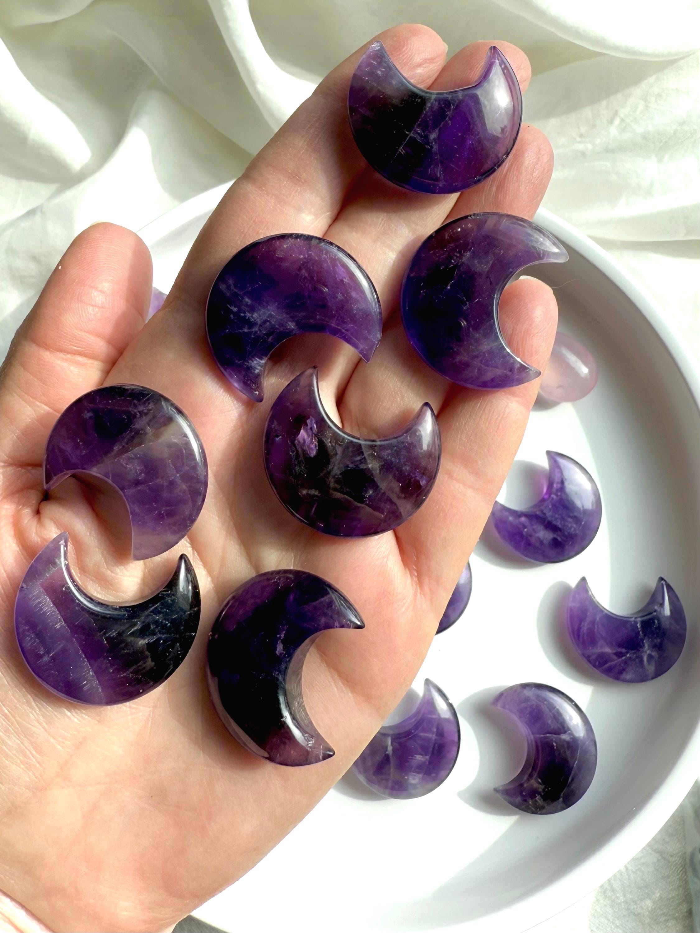 High quality deep purple Dream Amethyst Moons shown on my hand for scale