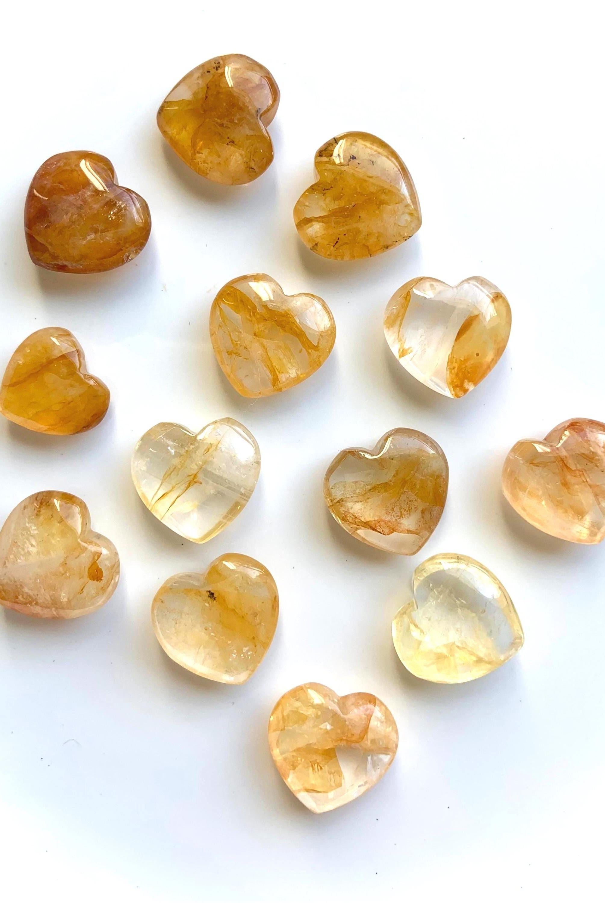 Tiny Golden Healer Crystal Hearts on a white background