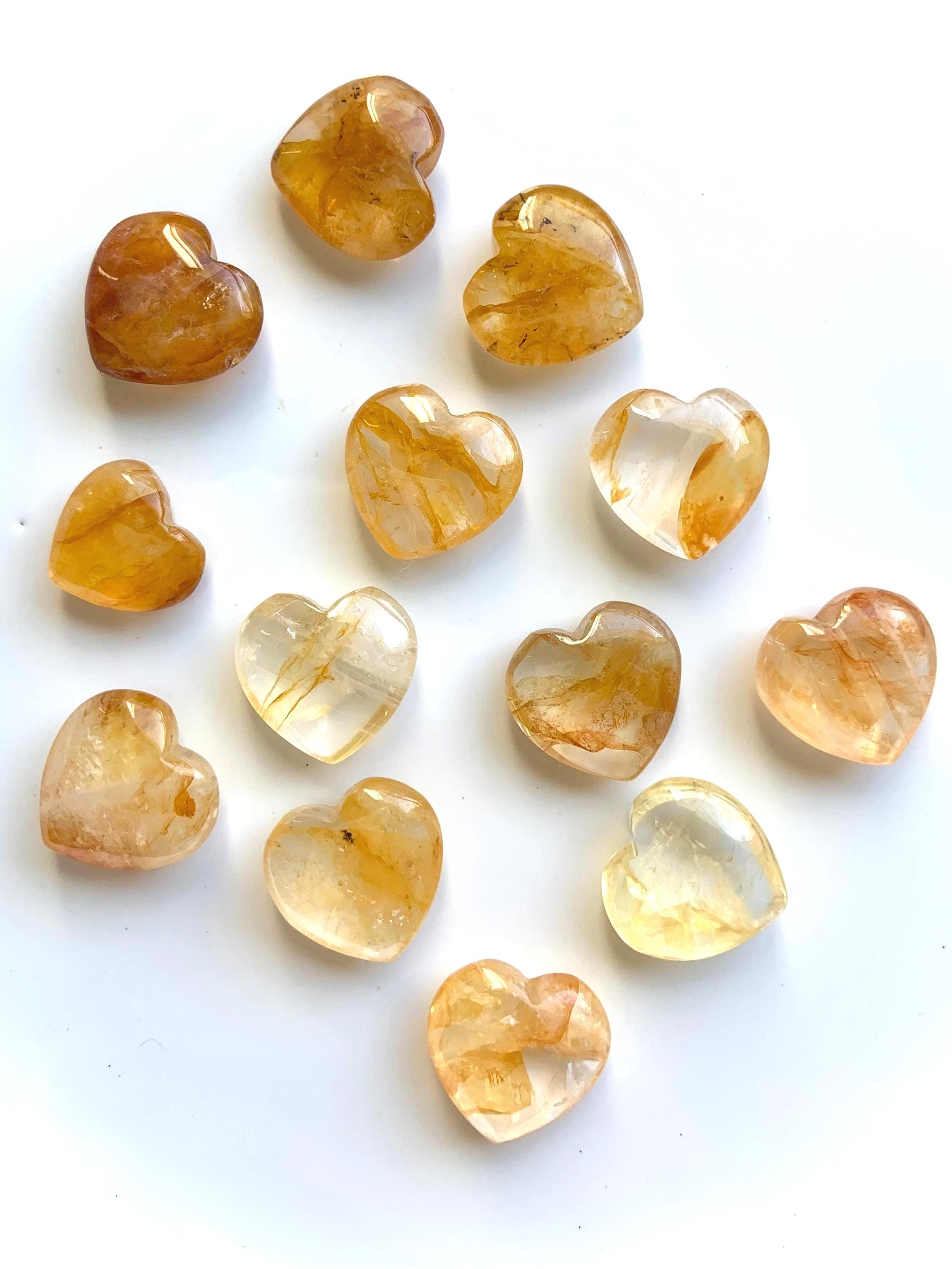 Tiny Golden Healer Crystal Hearts on a white background