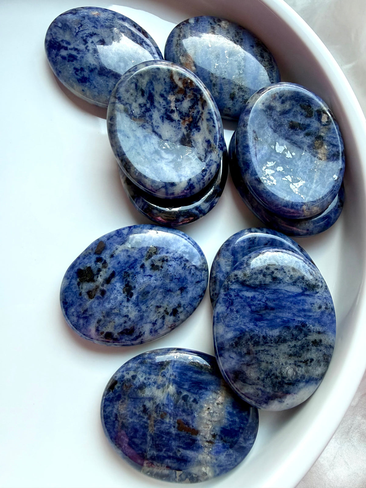 Blue Sodalite worry stones with unique white and gray patterns, natural healing crystals for clarity and communication