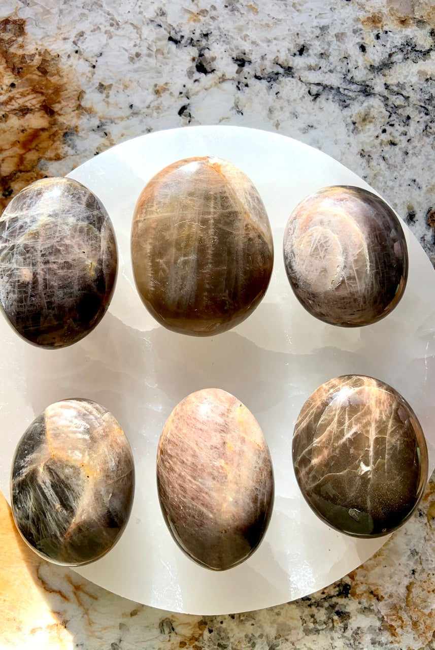 Hold a Black Moonstone Palm Stone to connect with New Moon energy and awaken your inner goddess