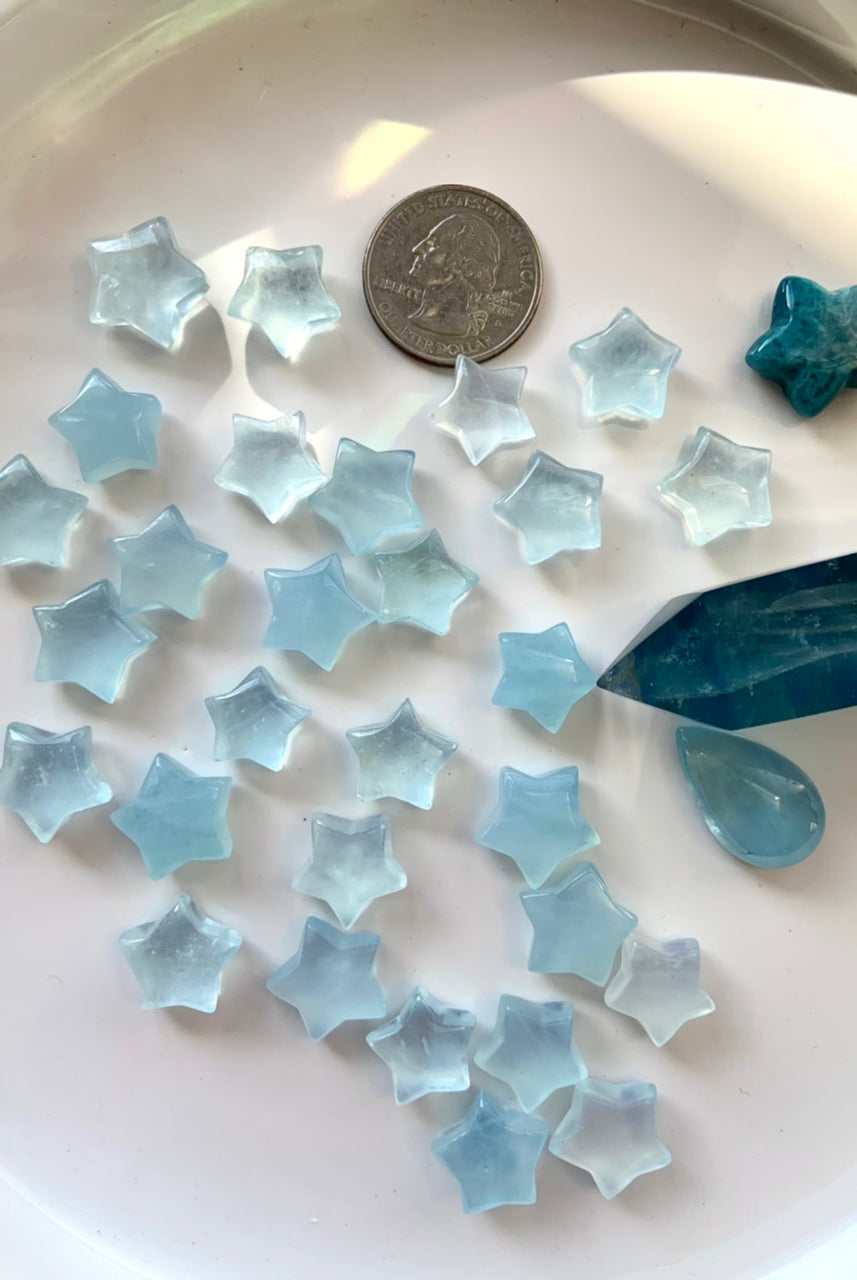 Luminous blue Aquamarine carvings reflecting natural light