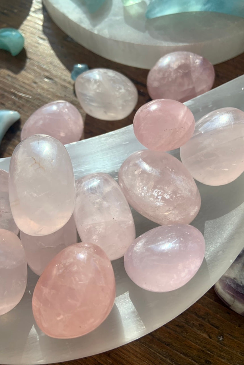 High quality rose quartz tumbled stones with lots of sparkle and pretty a translucent pink color