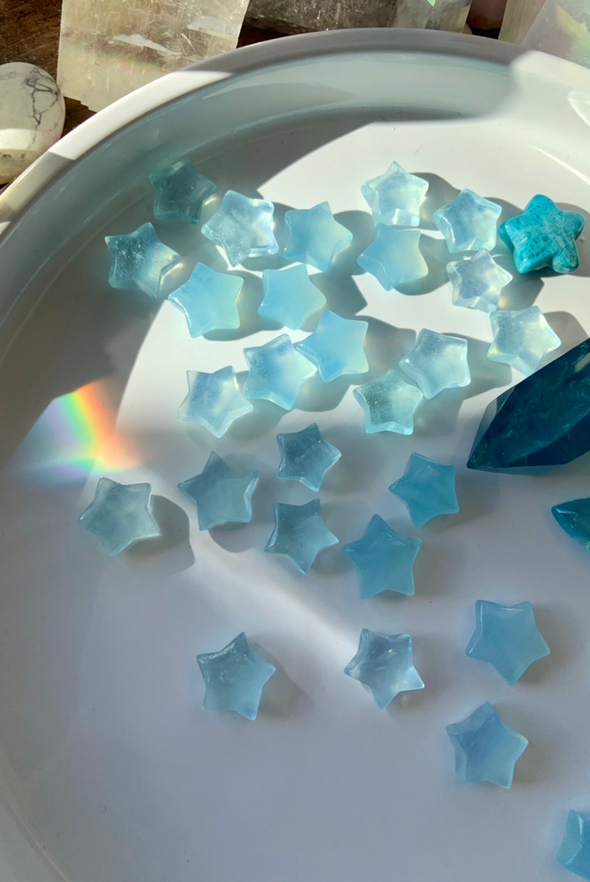 Luminous blue Aquamarine carvings reflecting natural light