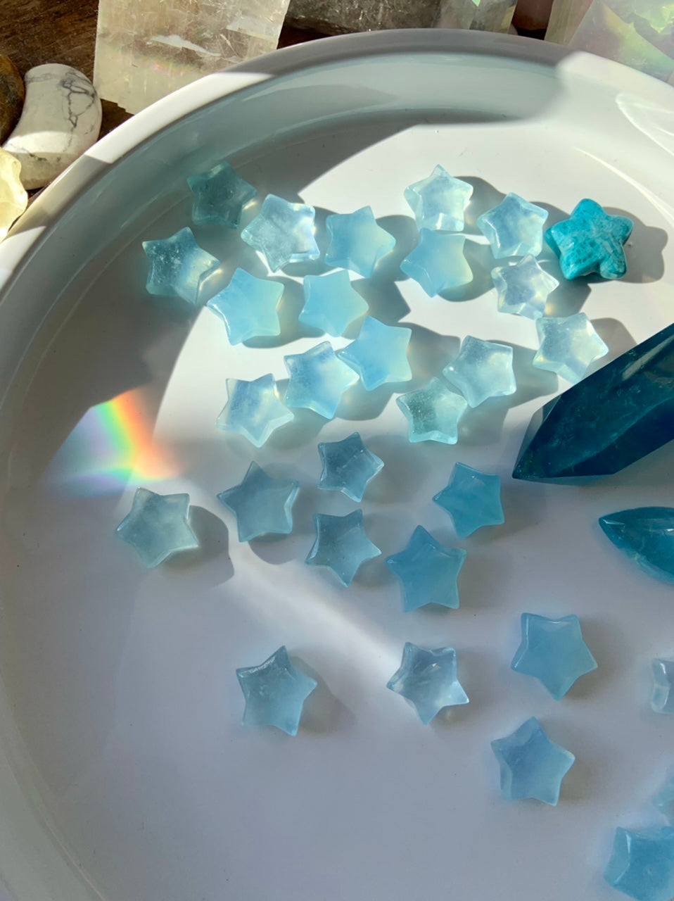 Luminous blue Aquamarine carvings reflecting natural light