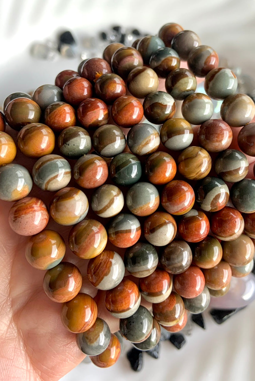 Wear your Polychrome Jasper bracelets to open the Root Chakra with a calming, grounding energy