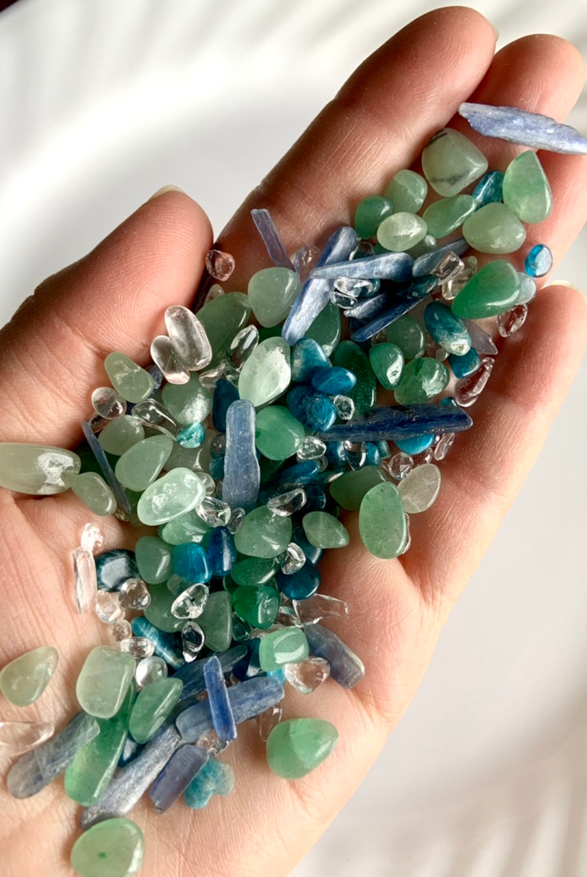 A close up view of the mermaid crystal confetti chips, shows 2 oz in my hand