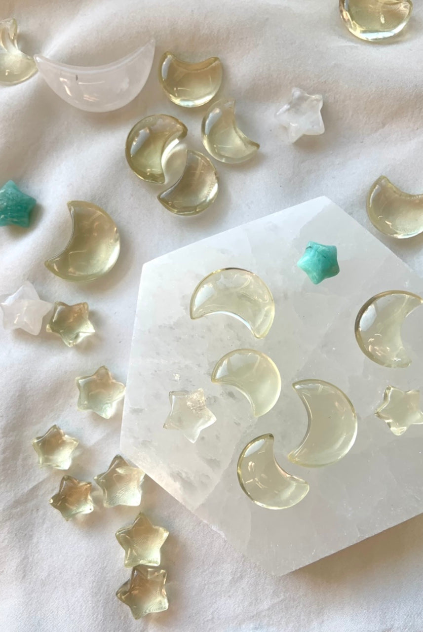 Mini lemon citrine moons and stars on a hexagonal selenite plate with celestial crystal accents — joyful mini crystals for abundance and solar energy