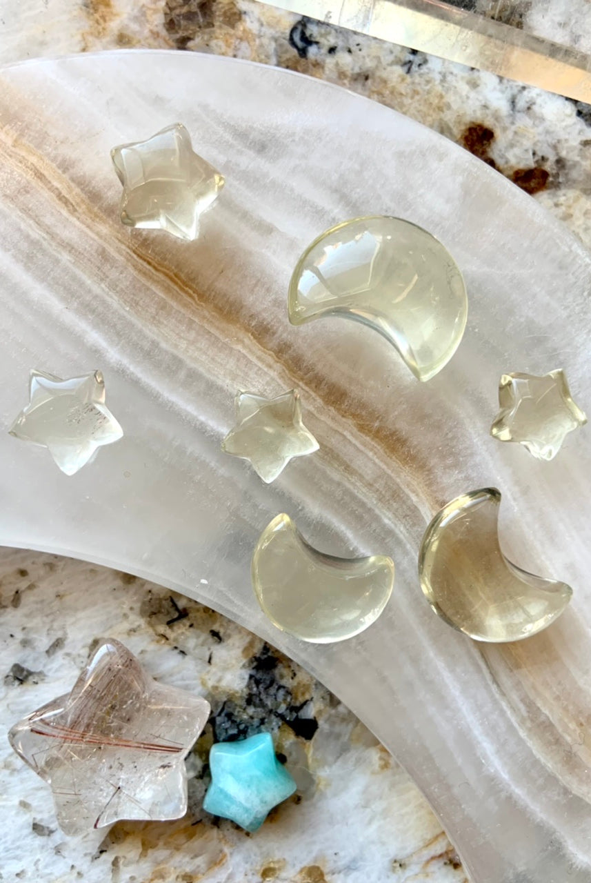 Citrine star and moon carvings on a stone moon dish with healing crystals — mini citrine carvings for chakra work and crystal grids