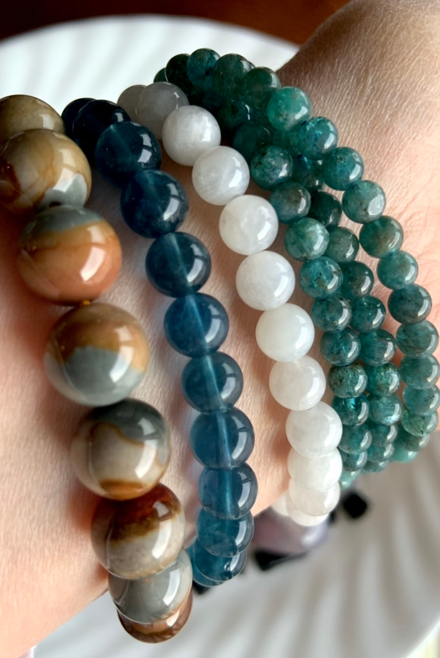 Our Polychrome Jasper bracelets shown with Teal Fluorite, White Moonstone and Blue Apatite bracelets