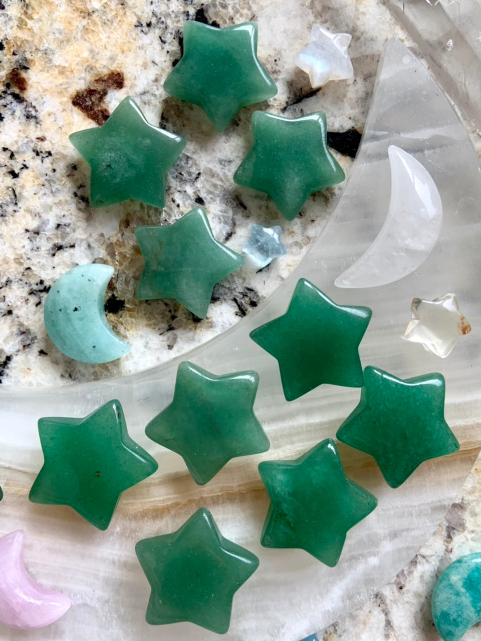 Array of Green Aventurine crystal stars with celestial carvings — heart chakra stones for abundance, growth, and good fortune.