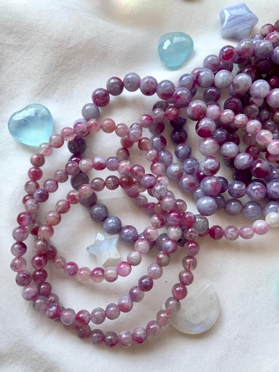 High quality pink and purple Unicorn Stone bracelets on white silk with mini crystal moons and stars – calming heart chakra jewelry for emotional healing & divine feminine energy