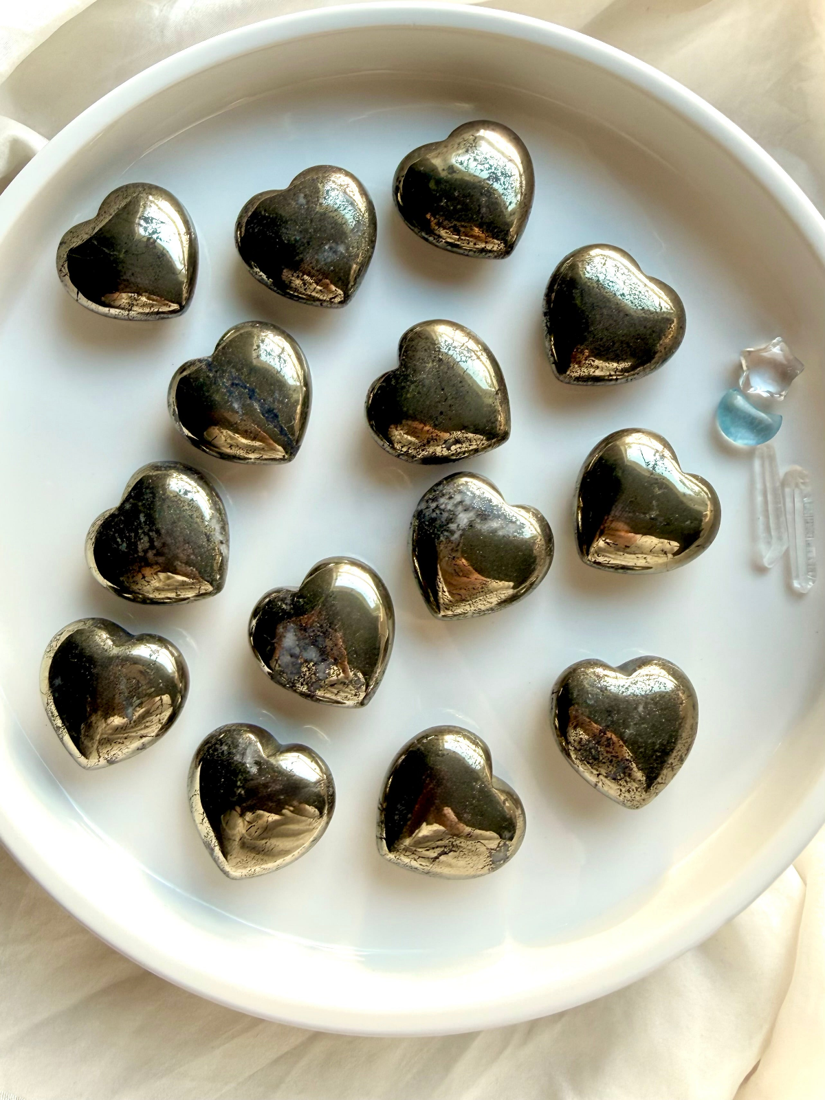     Golden Pyrite crystal collection with polished Pyrite hearts for abundance, confidence, and protection