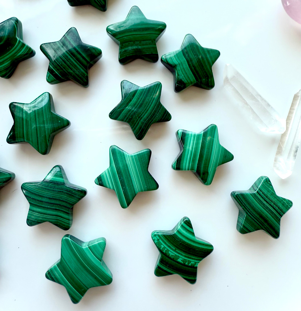 Polished Malachite crystal stars with swirling green banded patterns on white background with Clear Quartz points – Heart Chakra crystals for protection, growth, and transformation