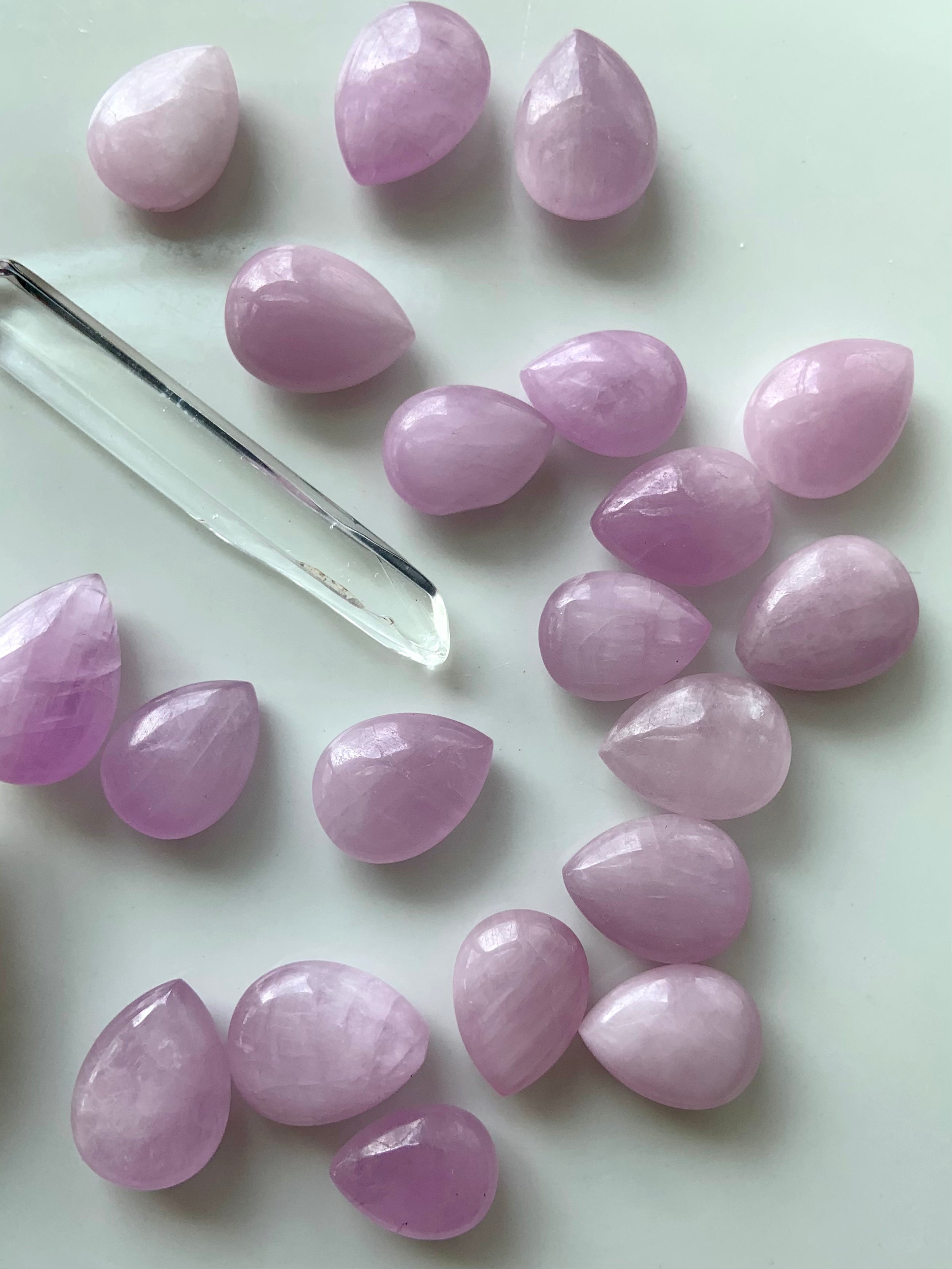 High-quality Kunzite crystal teardrops with clear quartz point on white background – Heart Chakra healing stones for love and emotional balance.