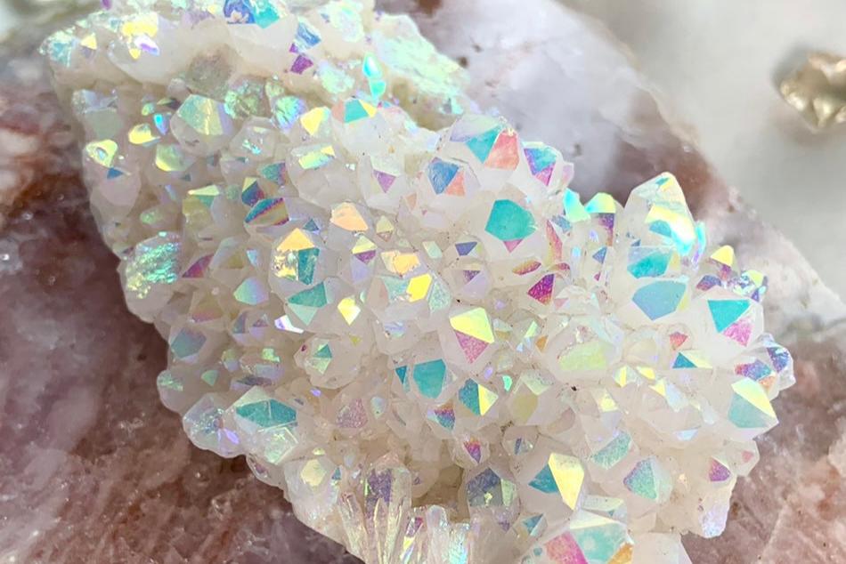 Iridescent aura quartz cluster with rainbow sheen — high-frequency crystal for spiritual awakening, divine connection, and Lightwork practices.