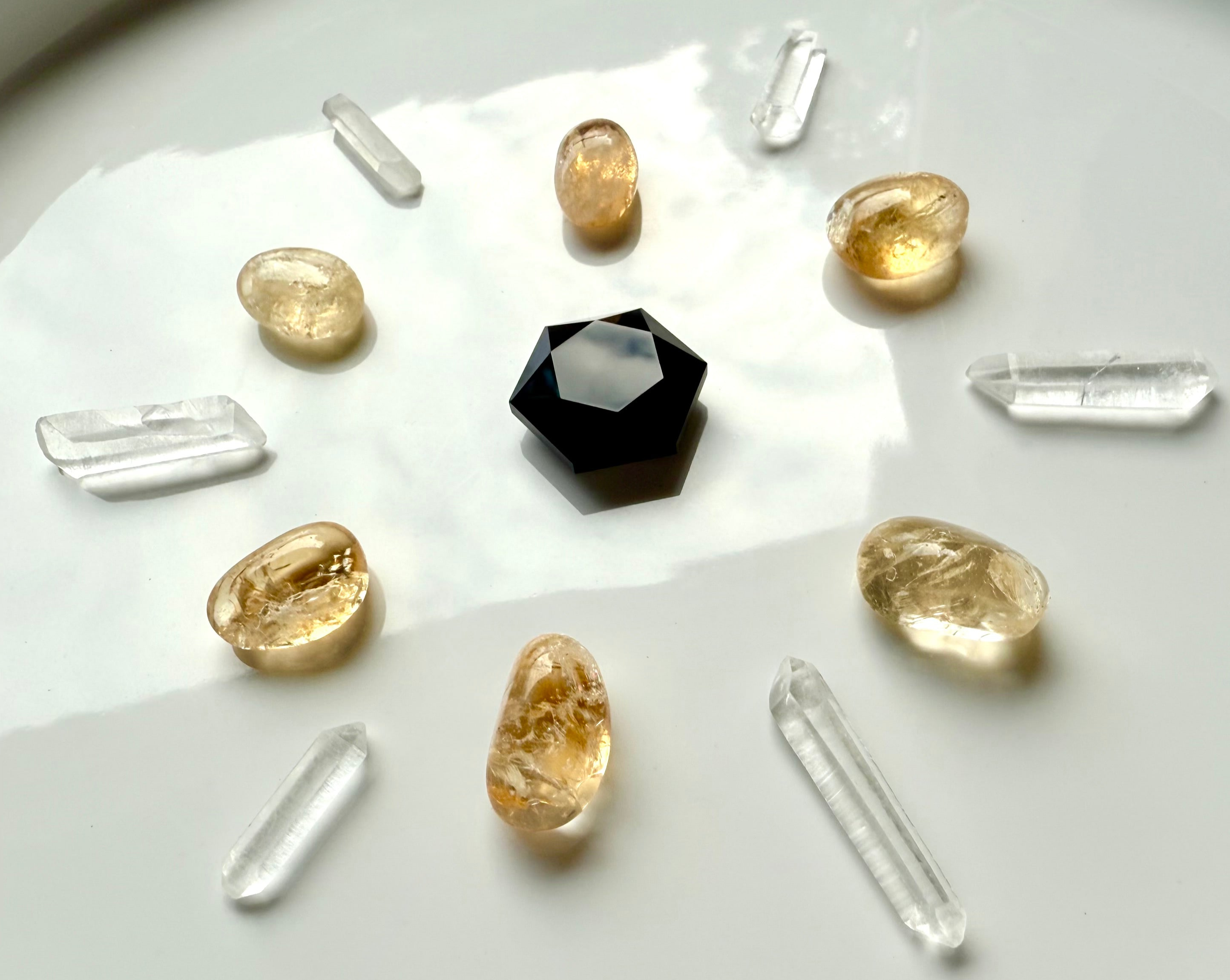 Crystal grid with black obsidian hexagon, citrine tumbles, and mini clear quartz points — mini crystals for energy healing and manifestation